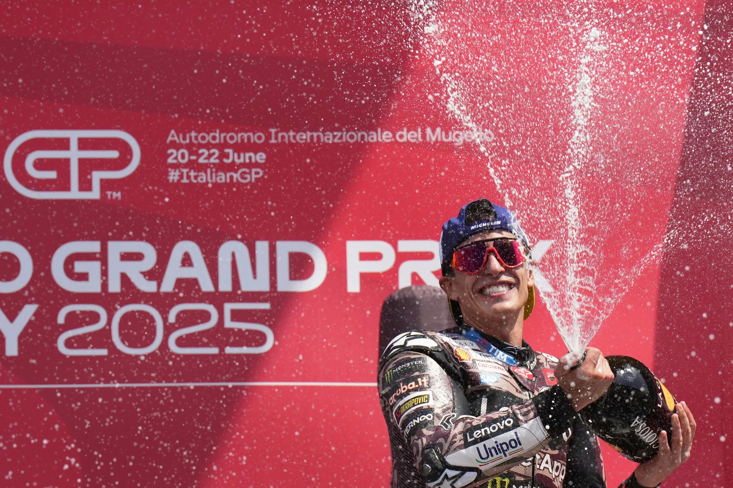 Marc Márquez celebrates on the podium