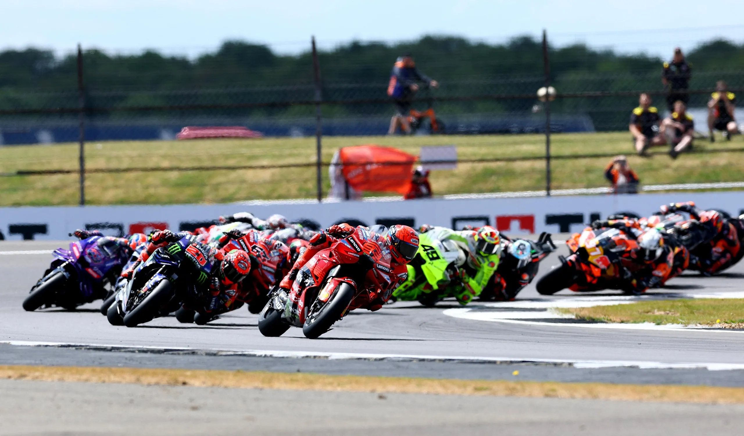 Marc Márquez leads into the first corner at the start of the afternoon