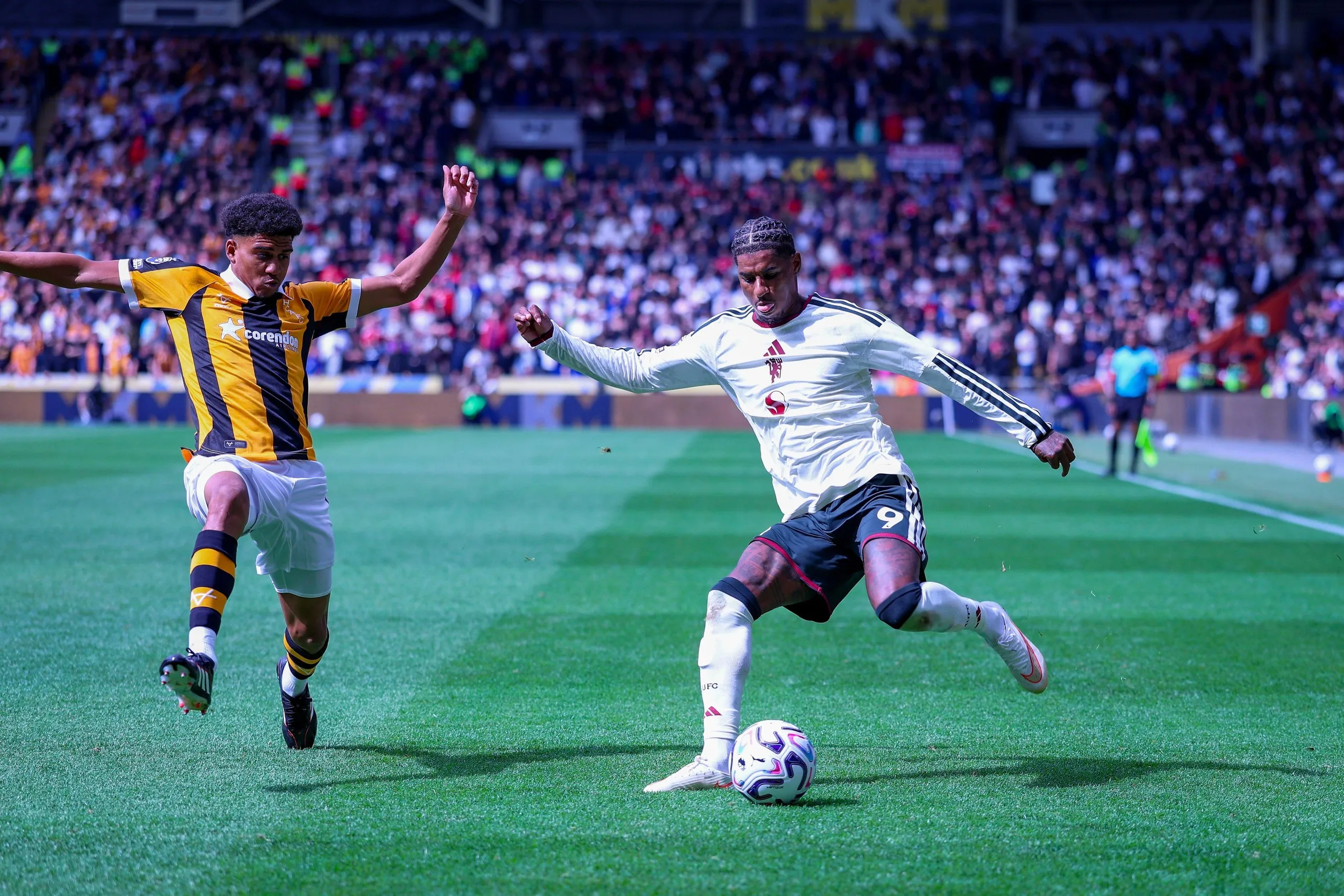 Lucas Herrington pressures Manchester United forward Marcus Rashford on Saturday