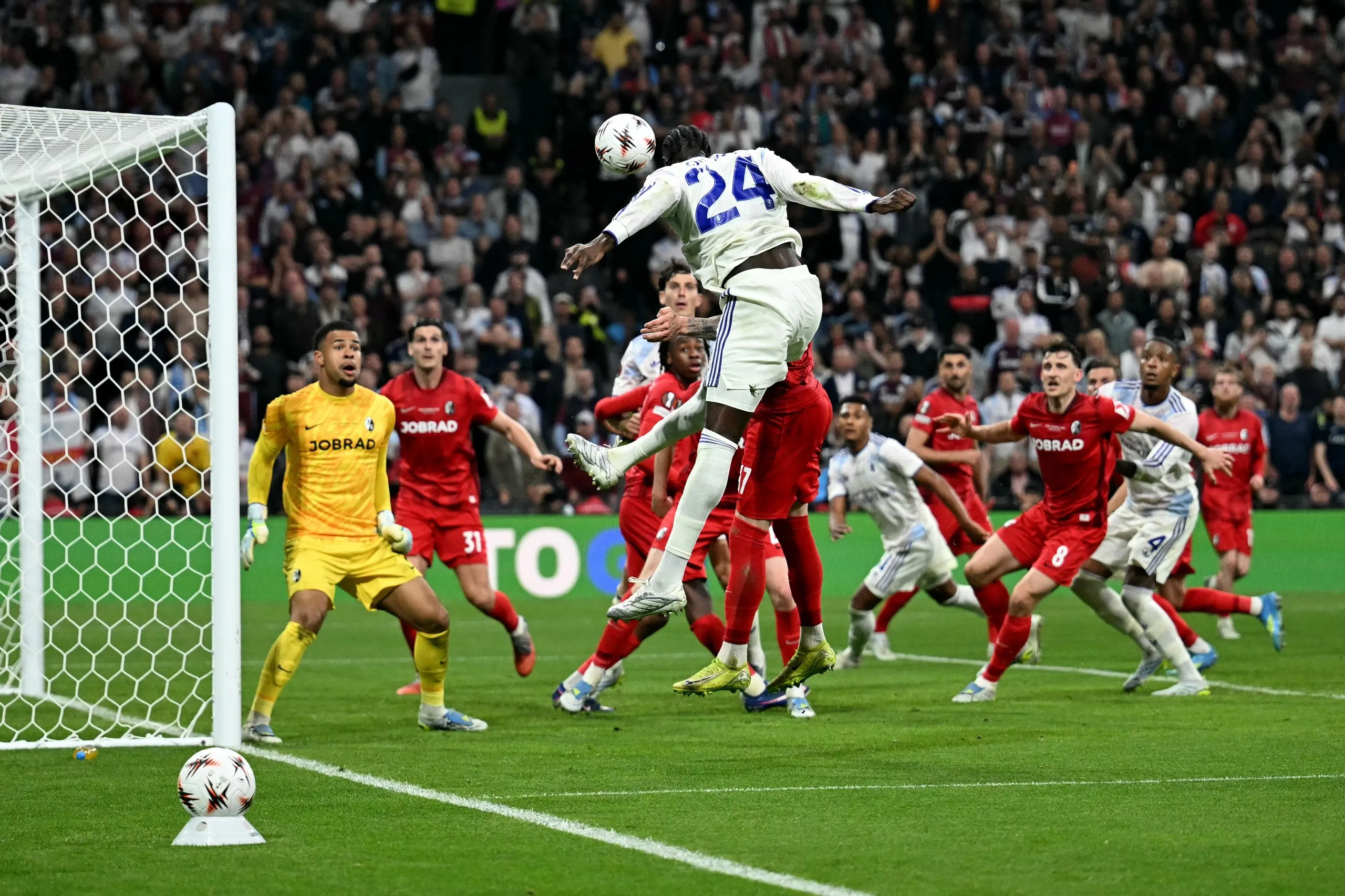 Amadou Onana heads the ball onto the post.
