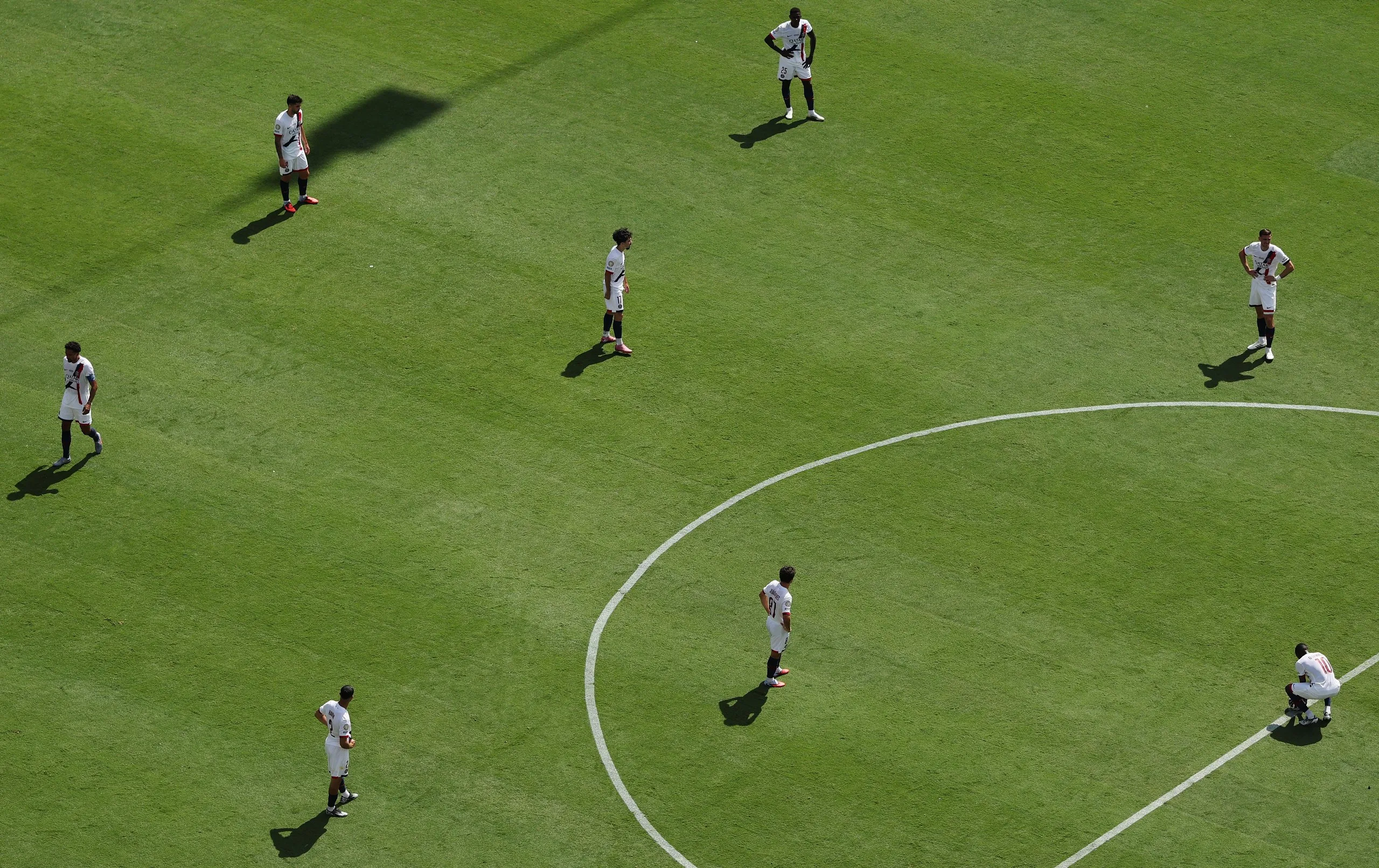 PSG players look around for answers after they go 2-0 down.