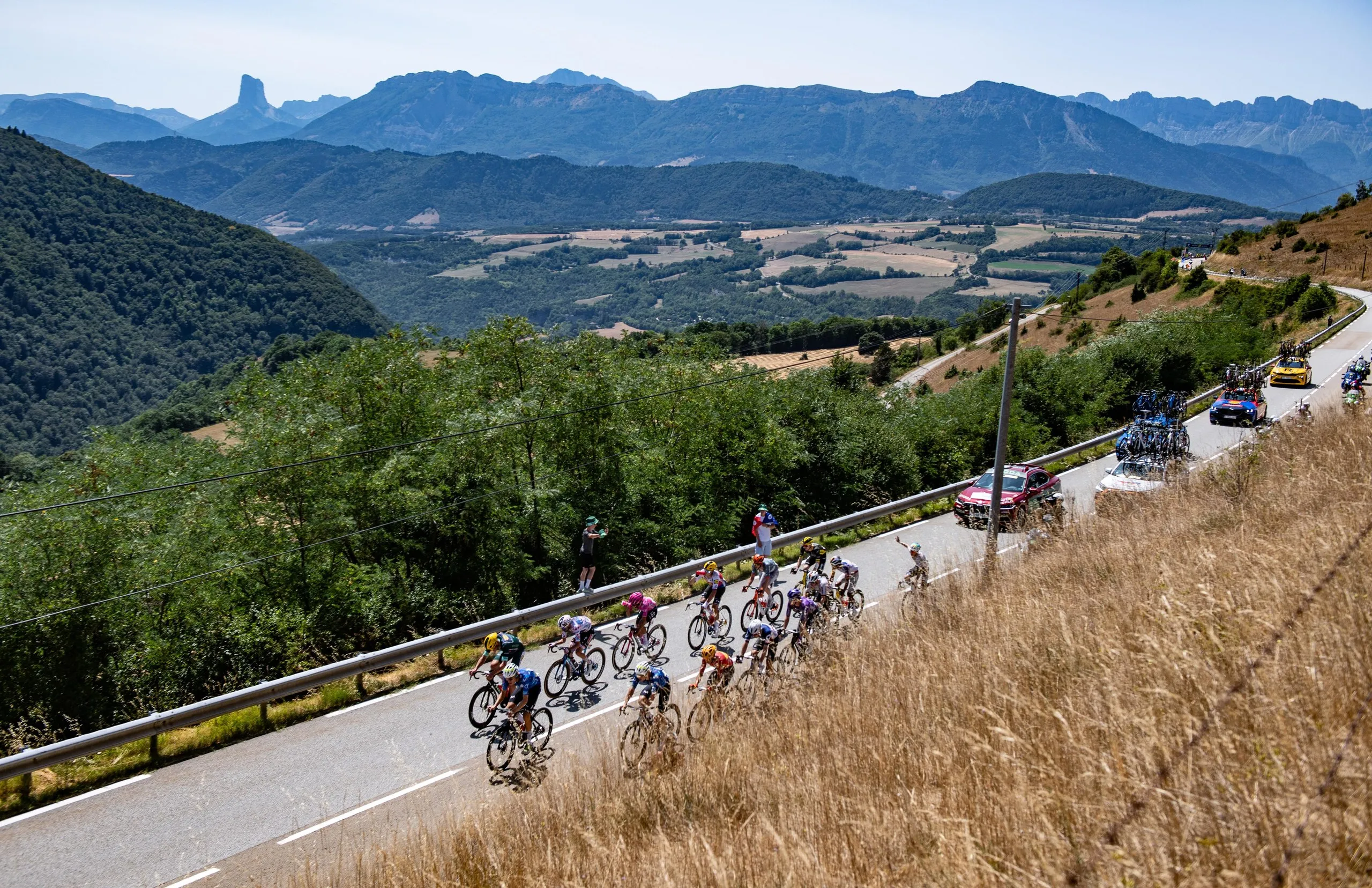 The breakaway with Mads Pedersen at the front ride through the Alpes during stage 18 from Voiron to Orcières Merlette.