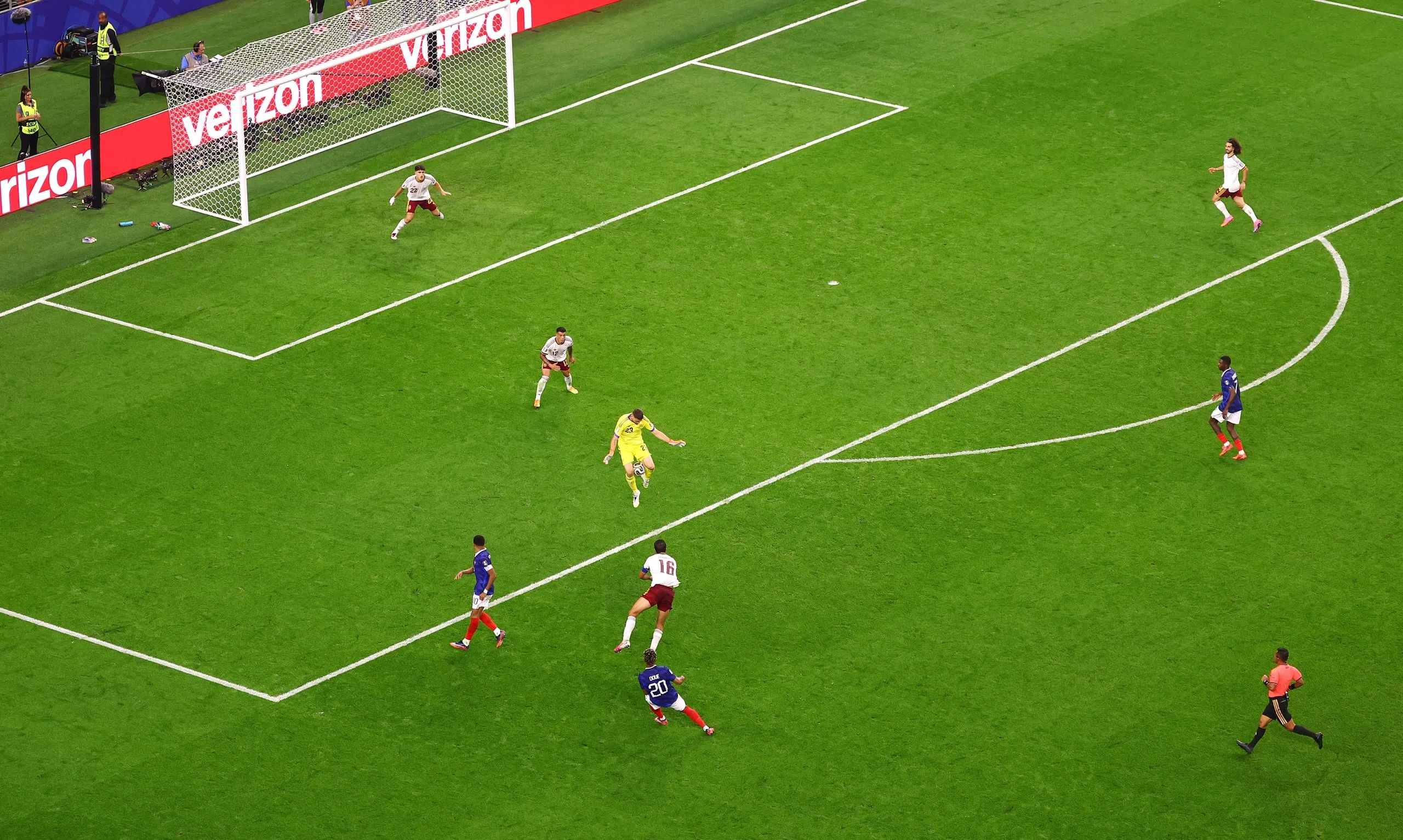 Spain's Unai Simon saves a long range shot from France's Desire Doue.
