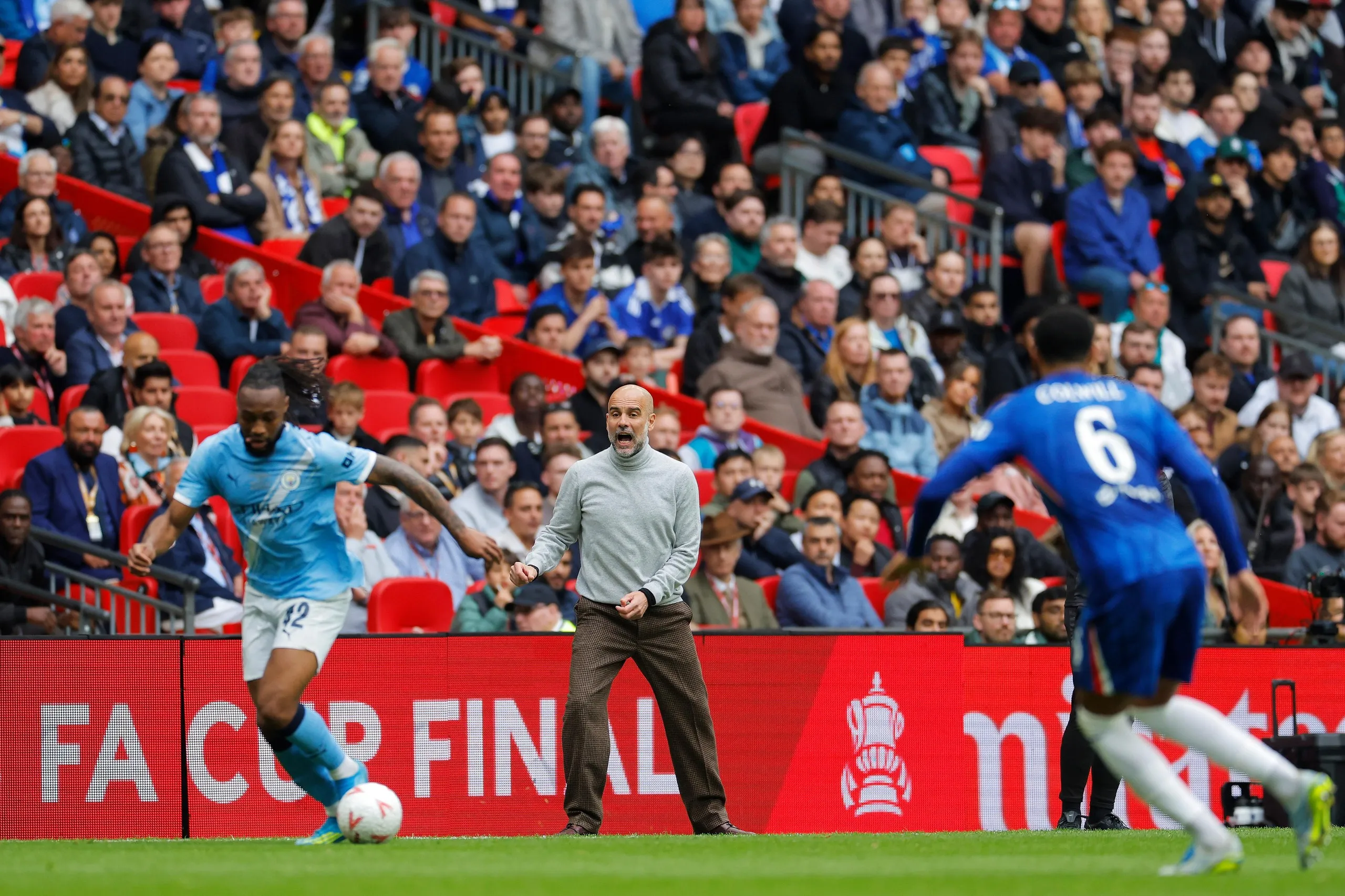 Manchester City manager Pep Guardiola reacts on the touchline.