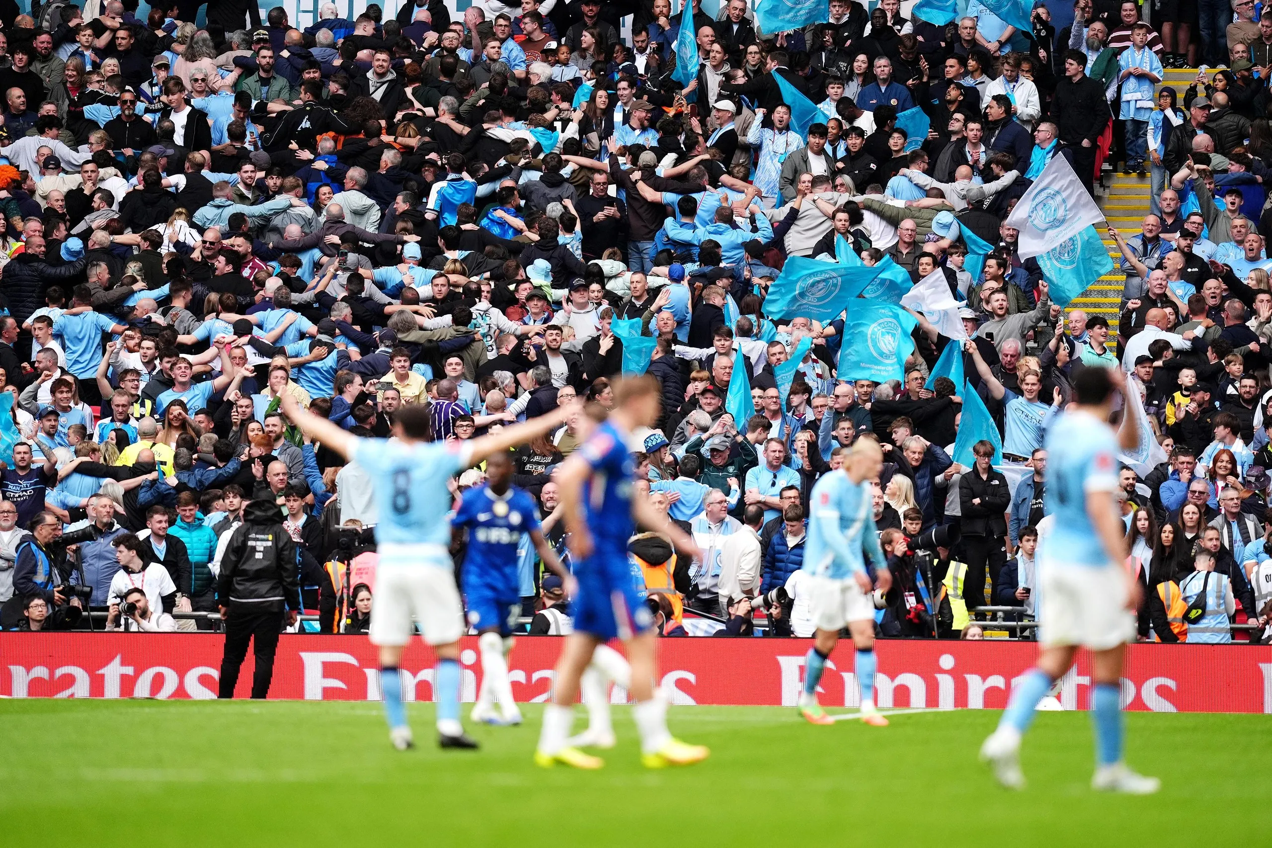 Manchester City fans celebrates winning the FA Cup final.
