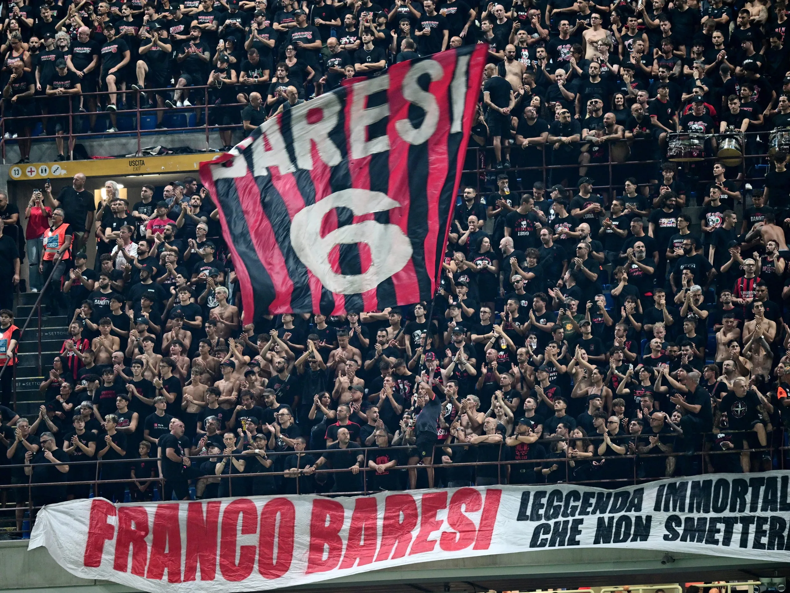 Milan supporters display a huge Baresi banner at San Siro before kick-off in the game against Venezia