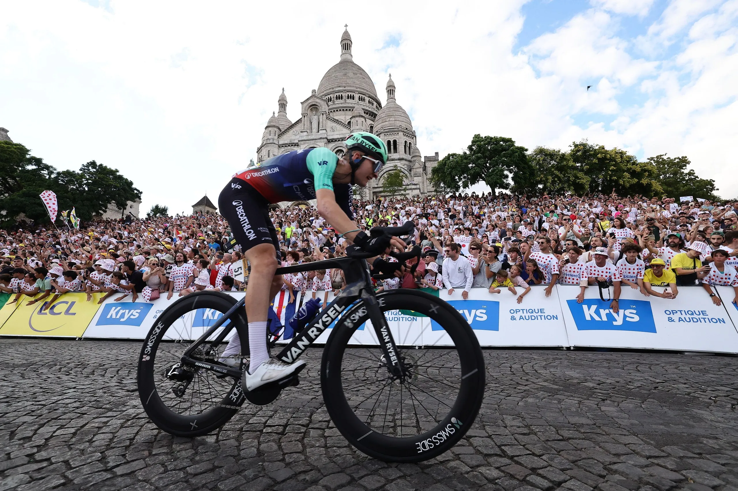 Paul Seixas in action during the final stage of the Tour de France