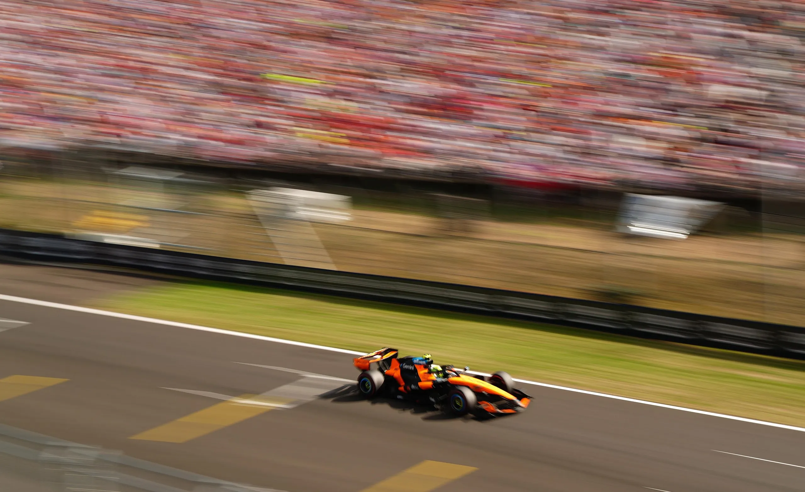 McLaren driver Lando Norris heads down a straight during qualifying.