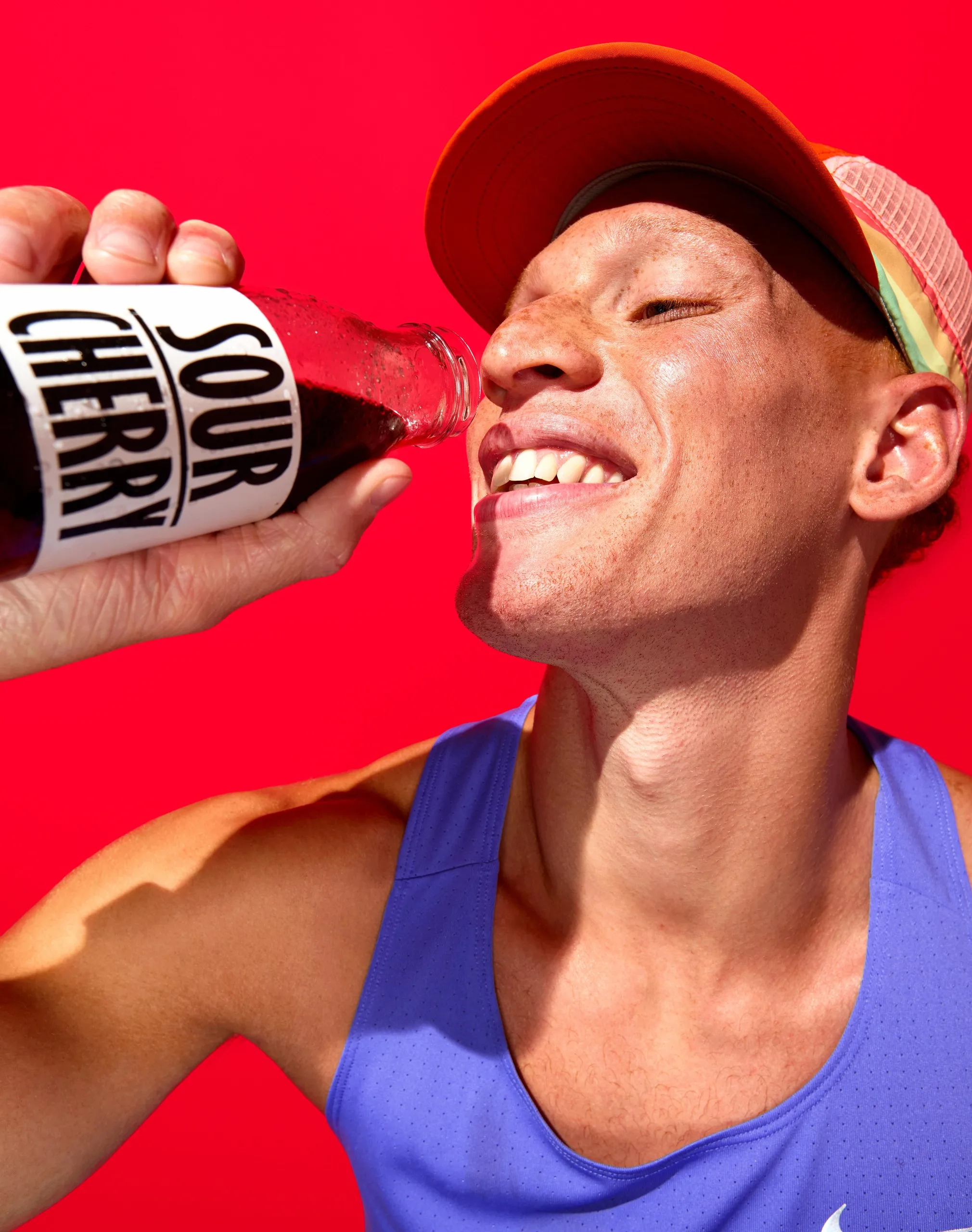 Picture of a man dressed as an athlete drinking sour cherry juice