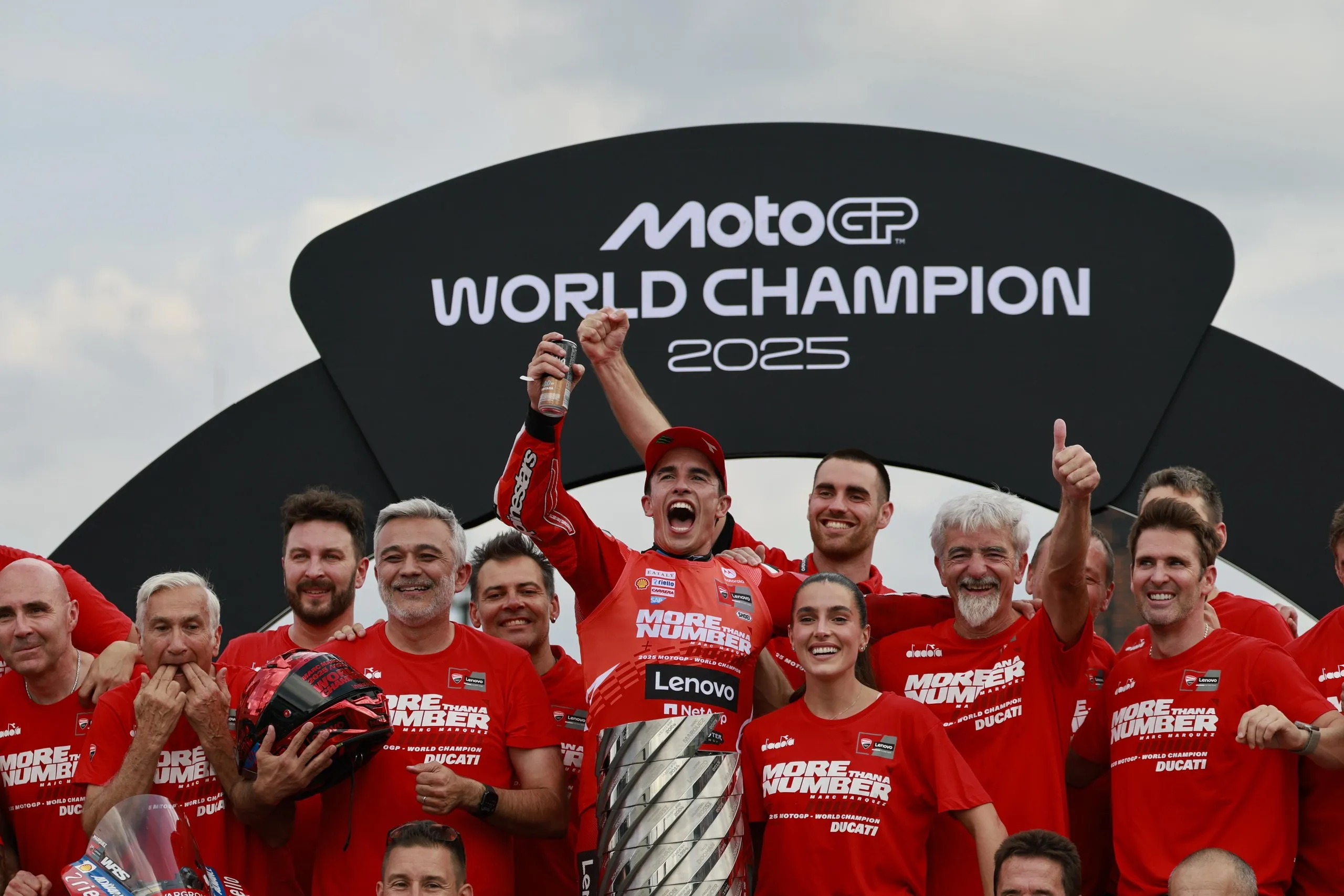 Márquez and the Ducati team celebrate with the MotoGP trophy