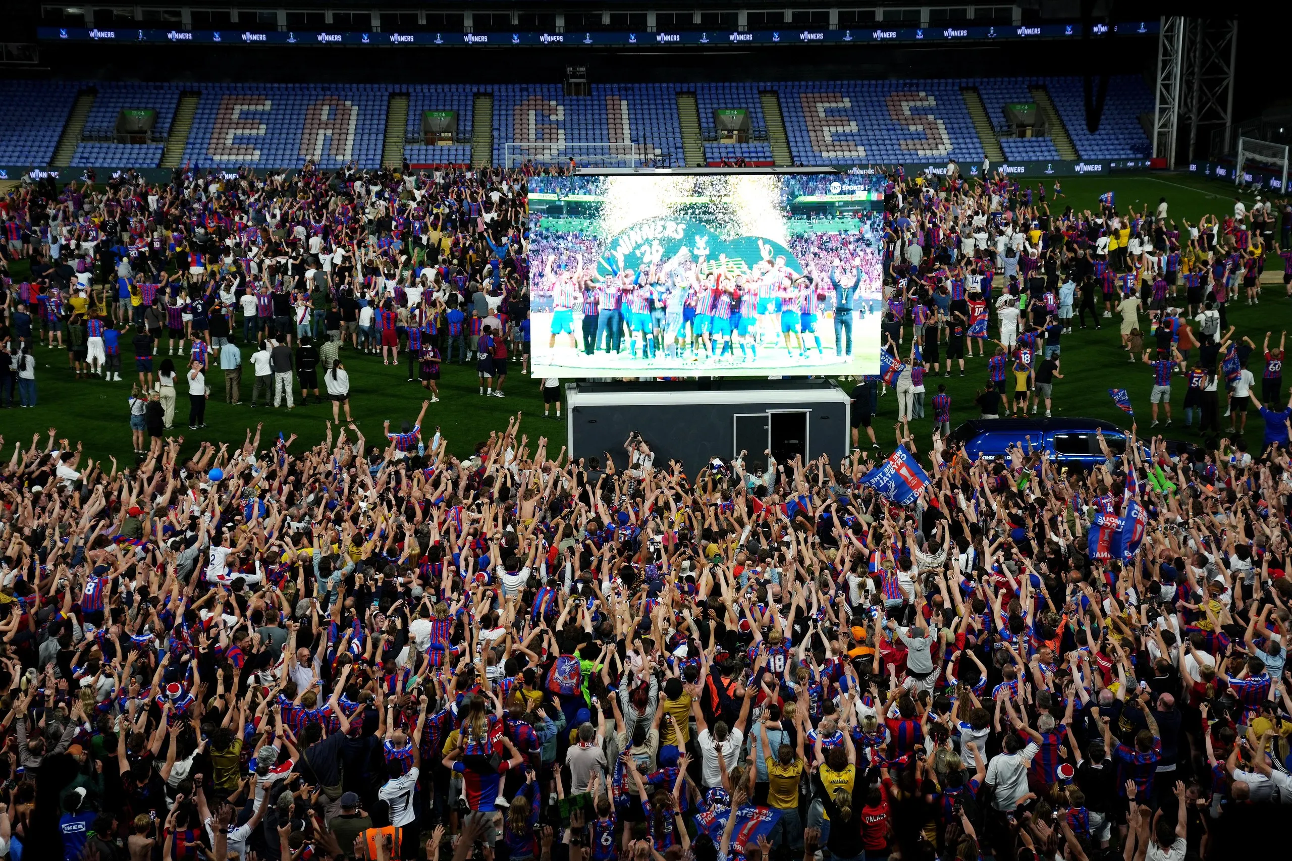 Crystal Palace fans watch their side lift the Uefa Conference League trophy during a screening of the final against Rayo Vallecano at Selhurst Park.