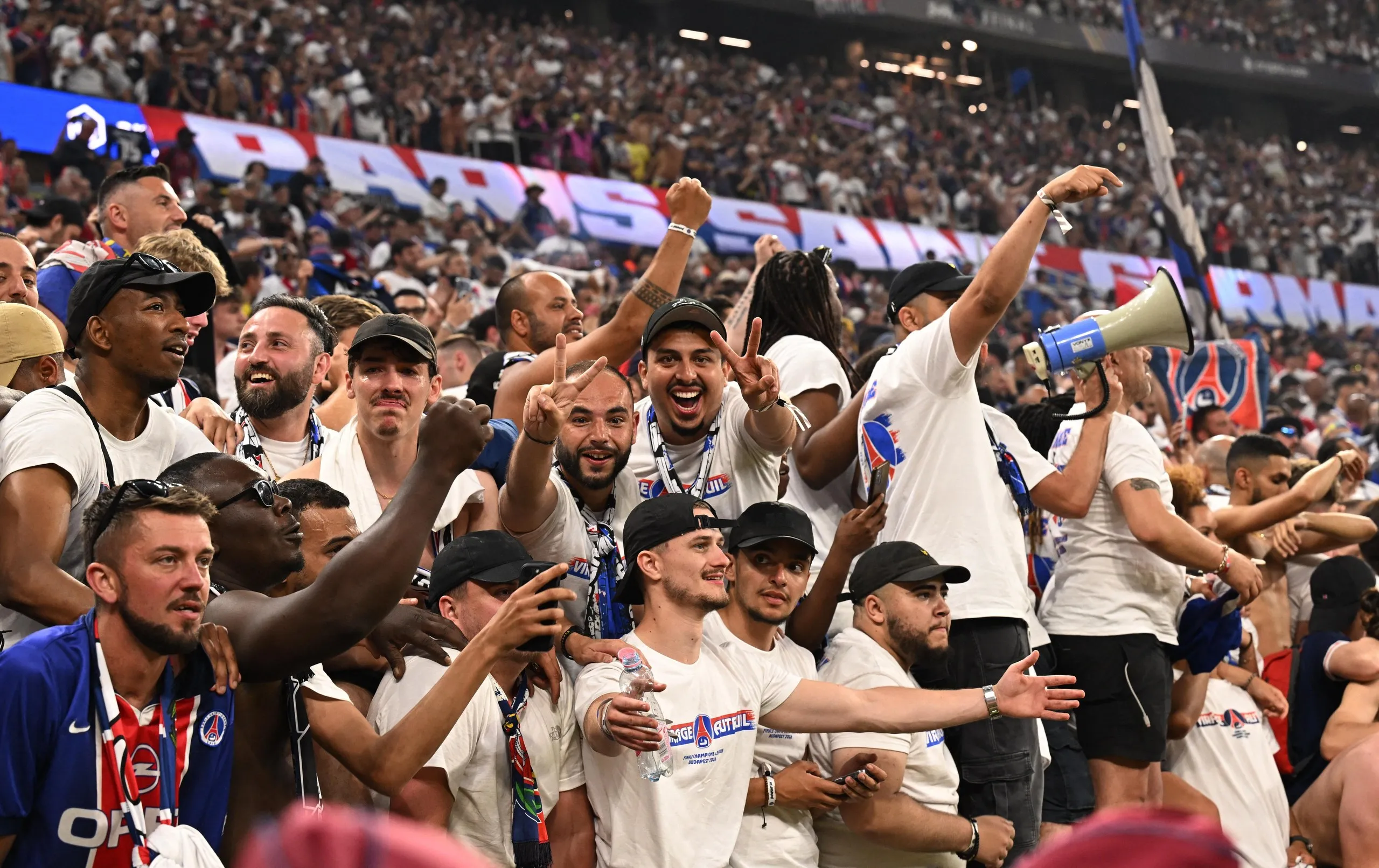 Paris St Germain fans celebrate after winning the Champions League.