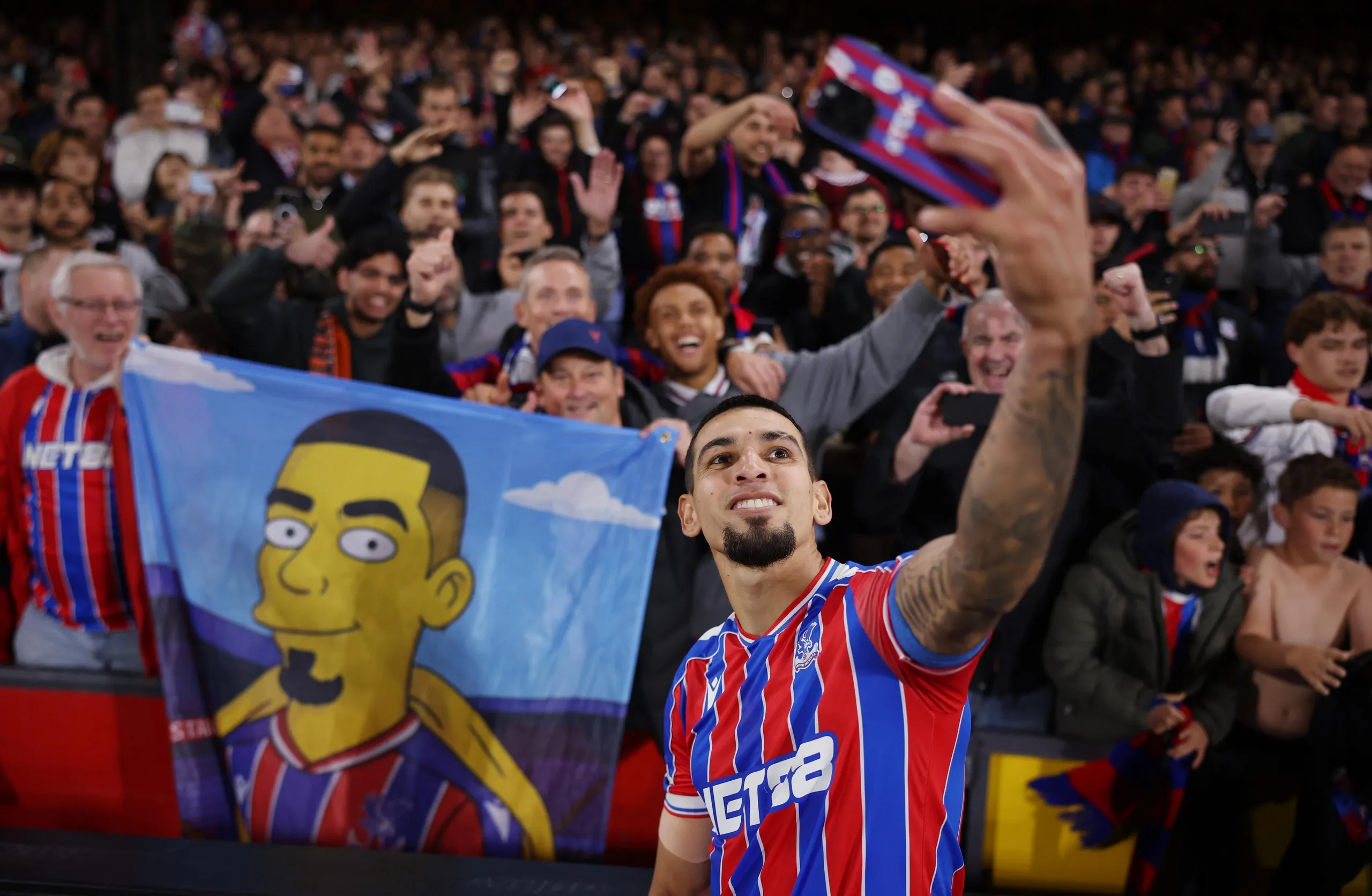 Daniel Muñoz celebrates with fans.