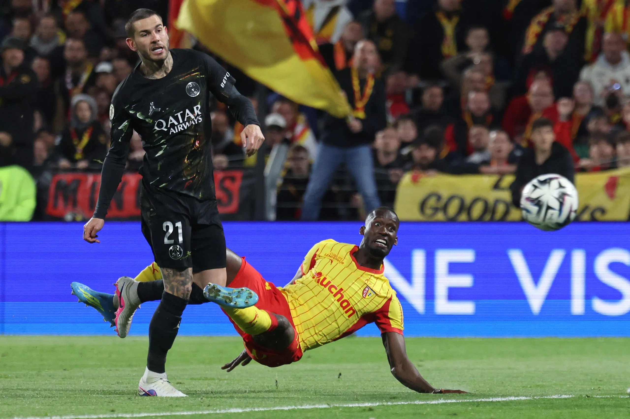 Paris Saint-Germain’s French Lucas Hernandez fights for the ball with Lens’ Abdallah Sima