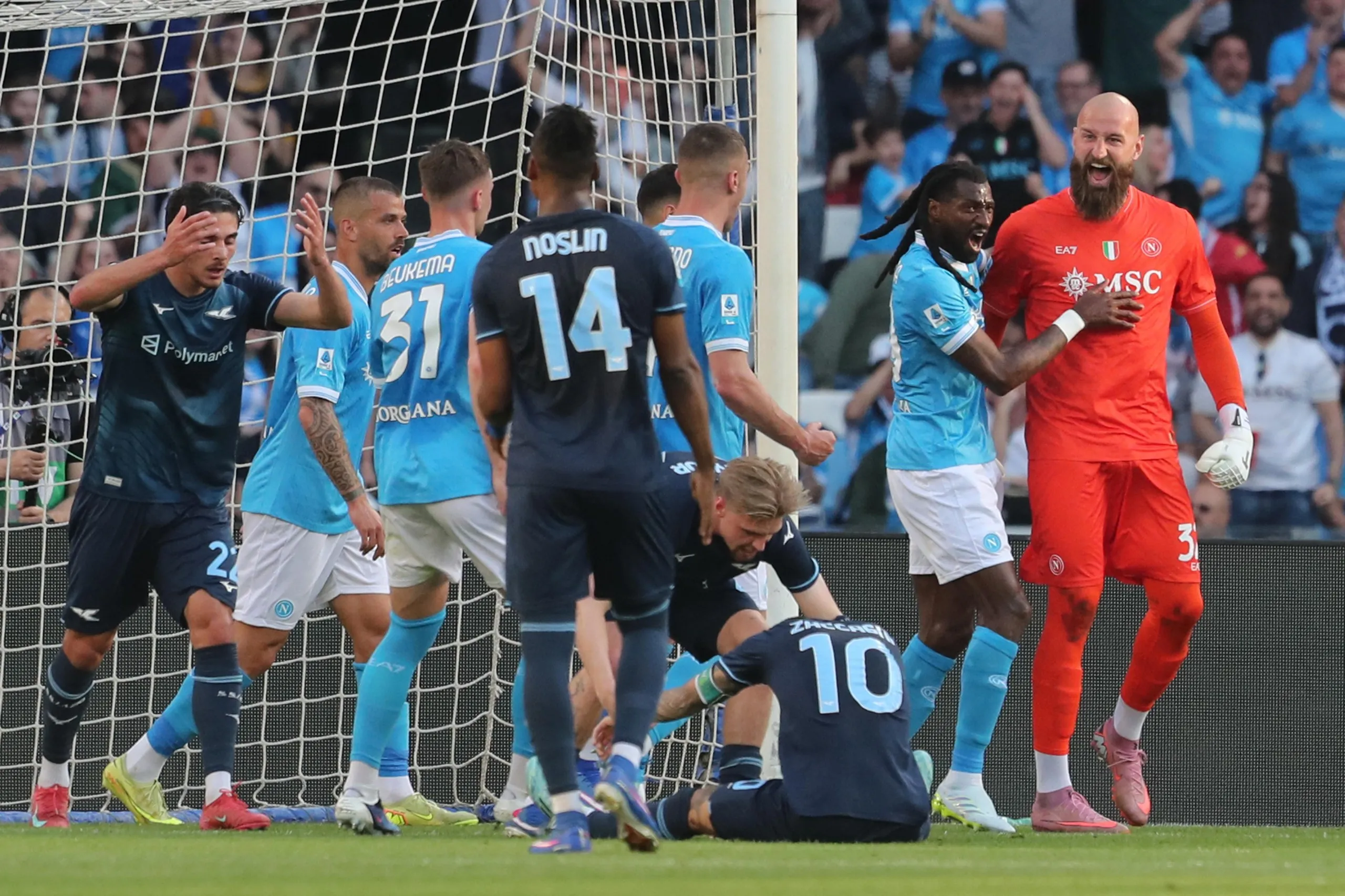 Napoli keeper Vanja Milinkovic-Savic celebrates saving Mattia Zaccagni’s penalty.
