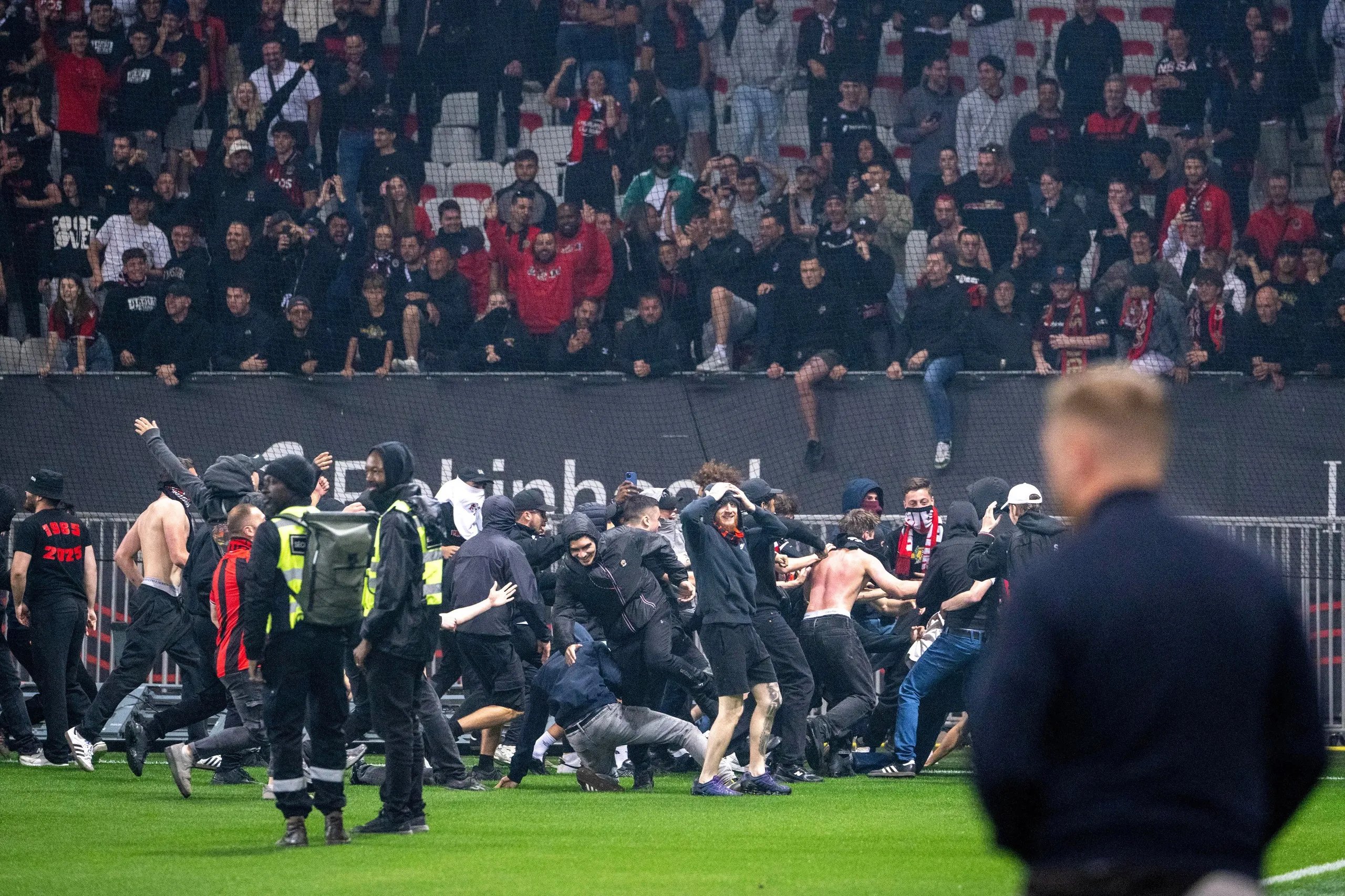 Nice fans invade the pitch after their goalless draw against Metz at the Allianz Riviera.
