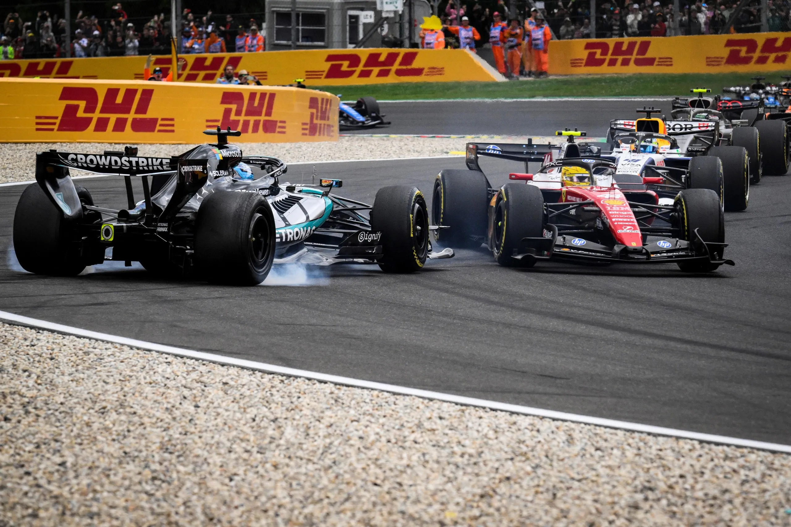 George Russell loses control of his Mercedes after contact with Lewis Hamilton’s Ferrari on the opening lap.