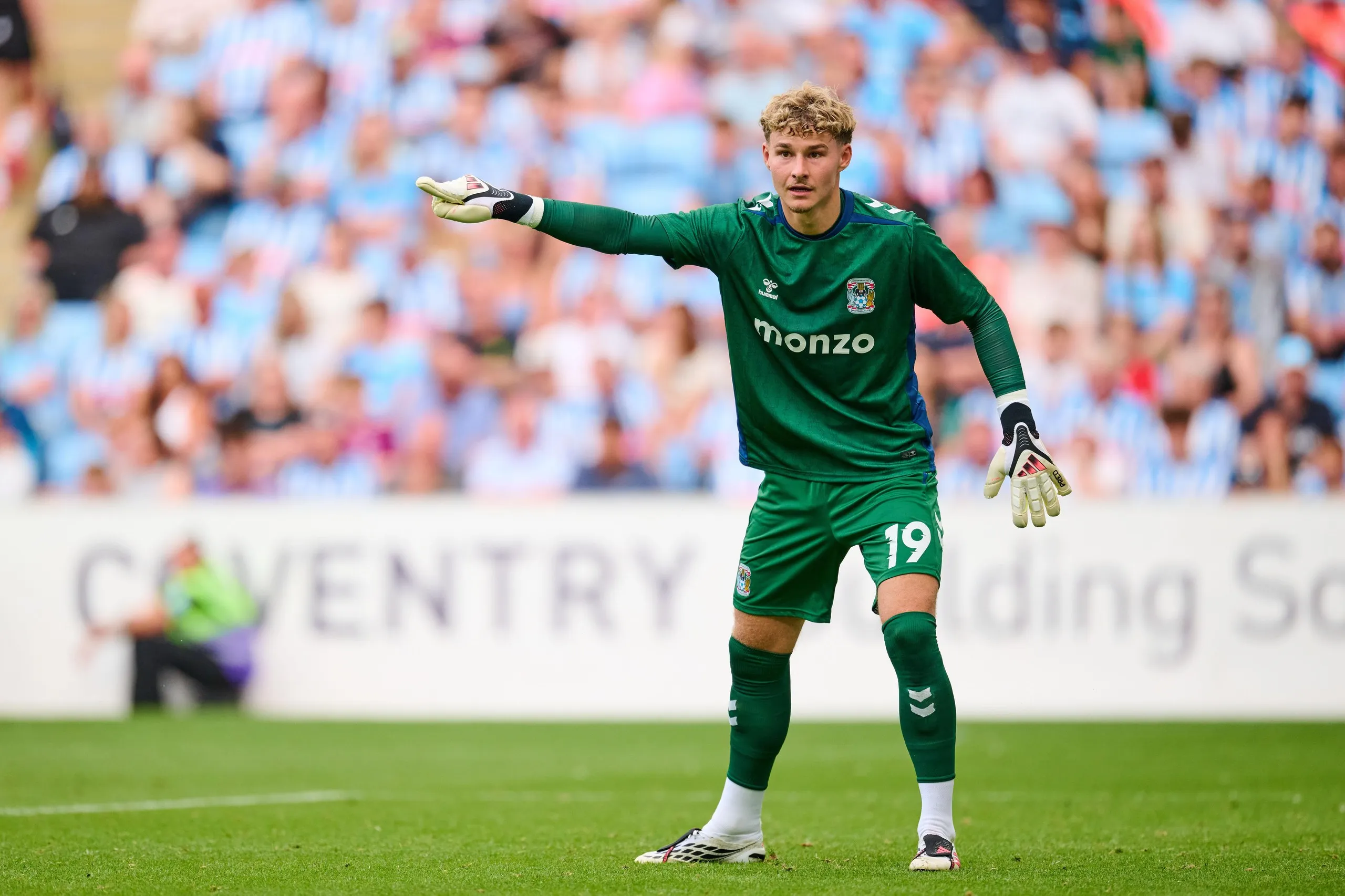 The Coventry goalkeeper Carl Rushworth gestures while instructing a teammate during a pre-season friendly at home to Espanyol.