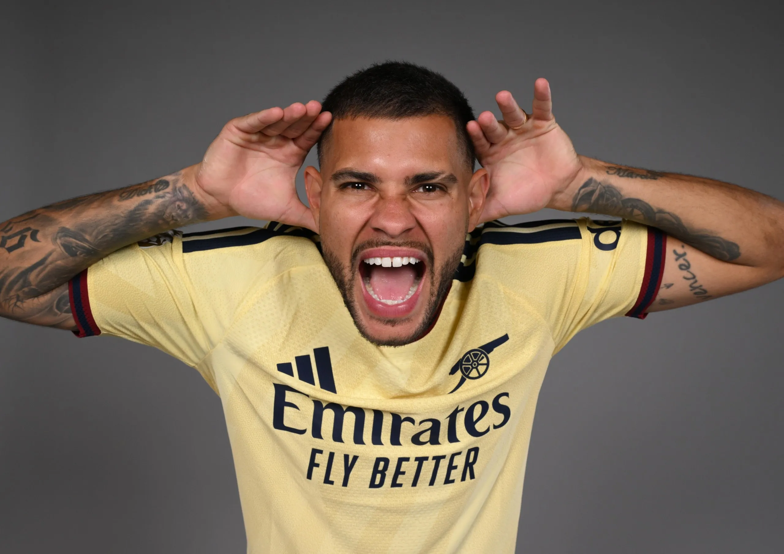 Bruno Guimarães poses with his goal celebration after signing for Arsenal.