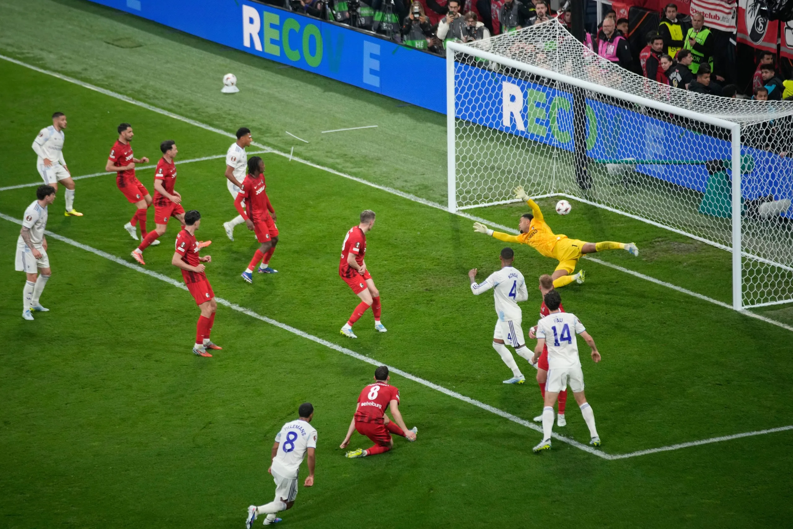 Aston Villa’s Youri Tielemans, bottom, scores his side’s opening goal during the Europa League final against Freiburg