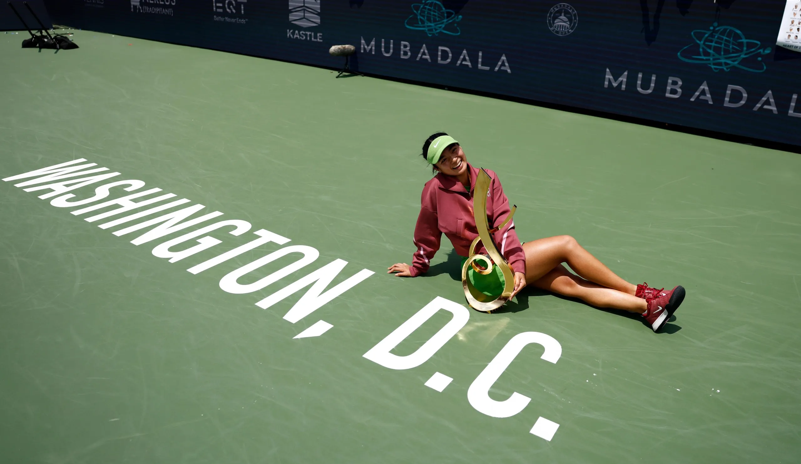 Alexandra Eala poses with her trophy after beating Jessica Pegula.