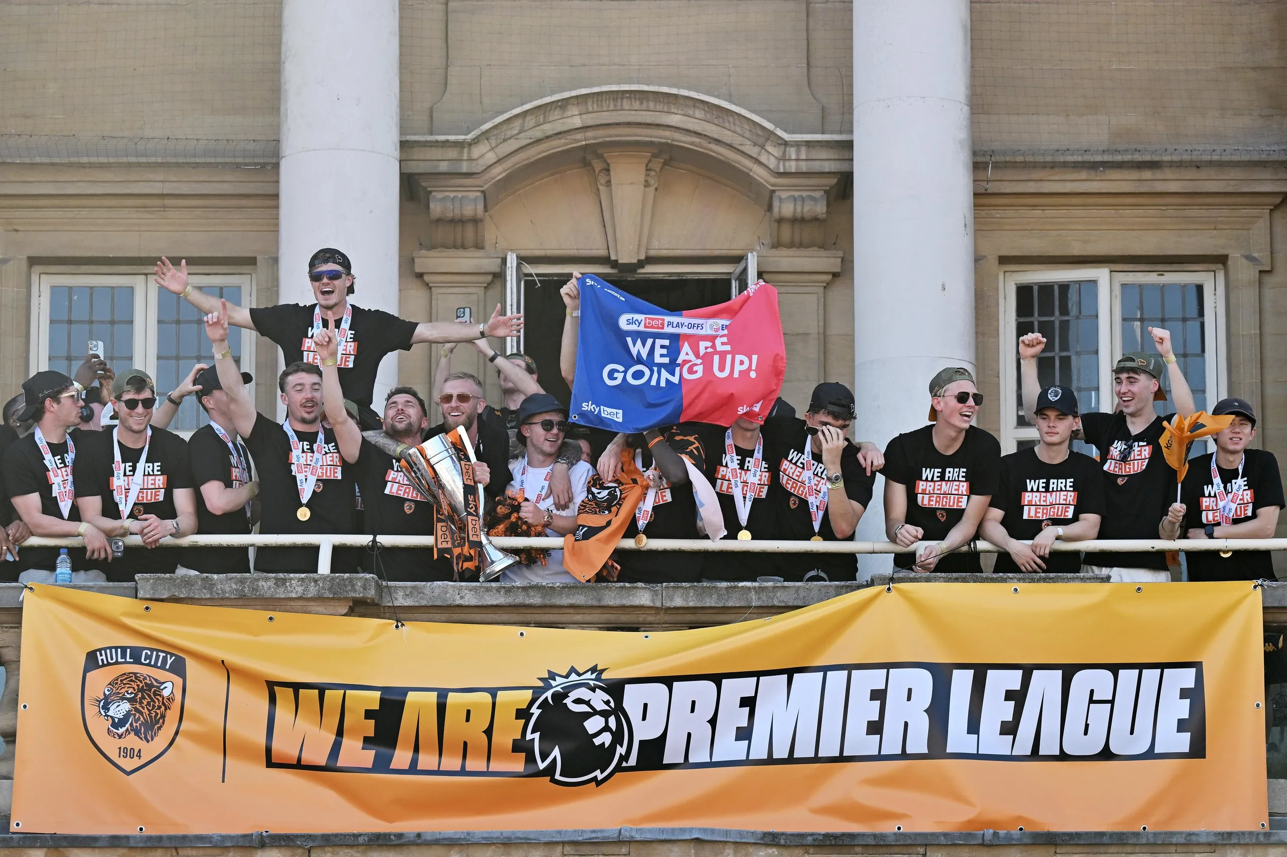 Hull City players celebrate reaching the Premier League with a victory parade.