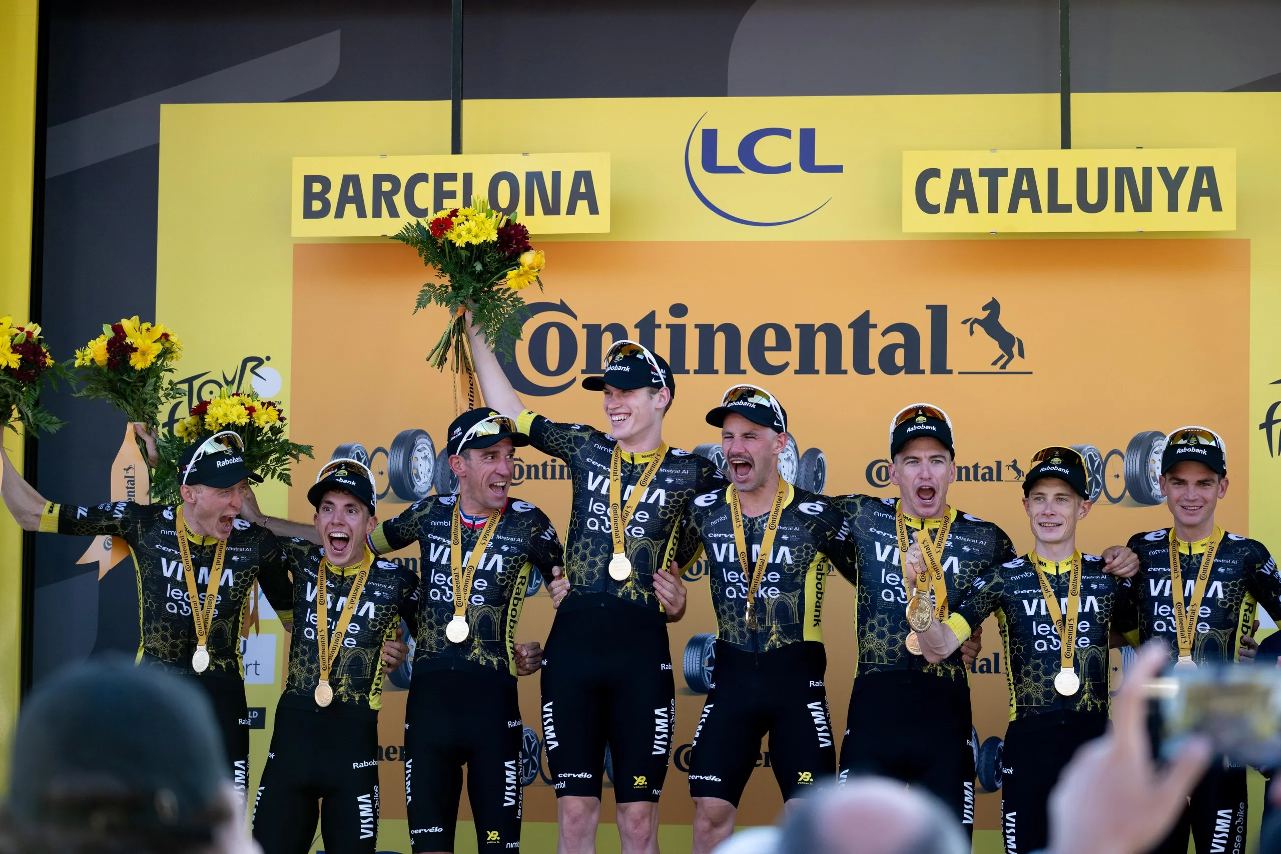 Team Visma-Lease a Bike celebrate on the podium