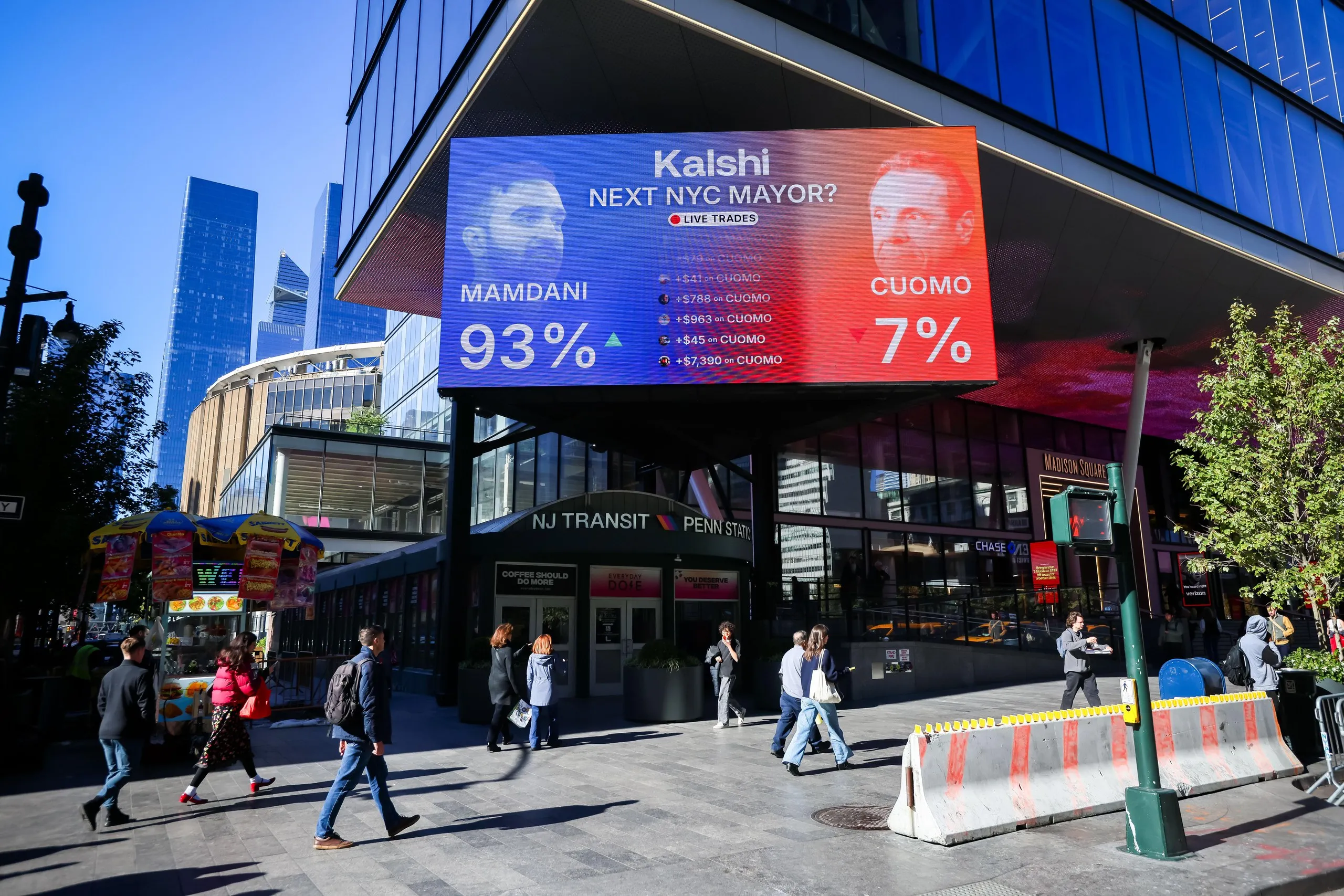 A billboard outside a metro station shows betting odds for the next New York mayor
