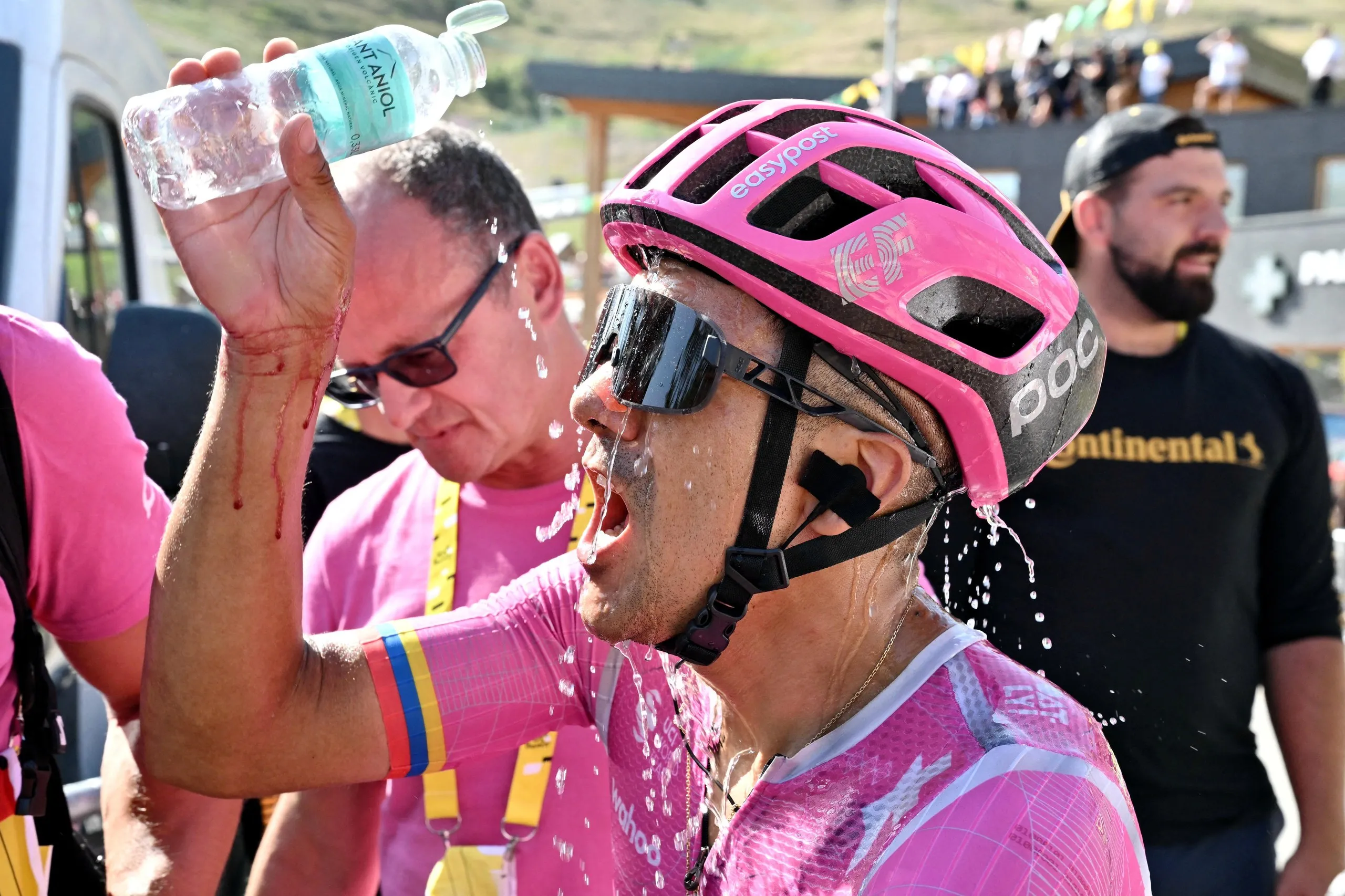 Richard Carapaz pours water on himself after winning stage 18 of the Tour de France