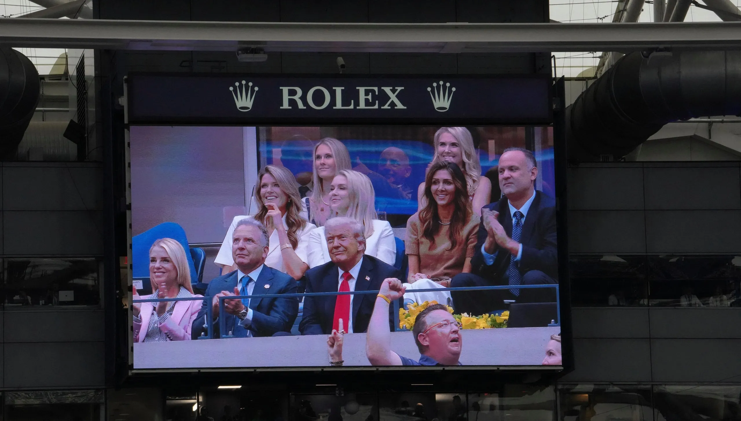 Donald Trump appears on the jumbotron during the US Open final.