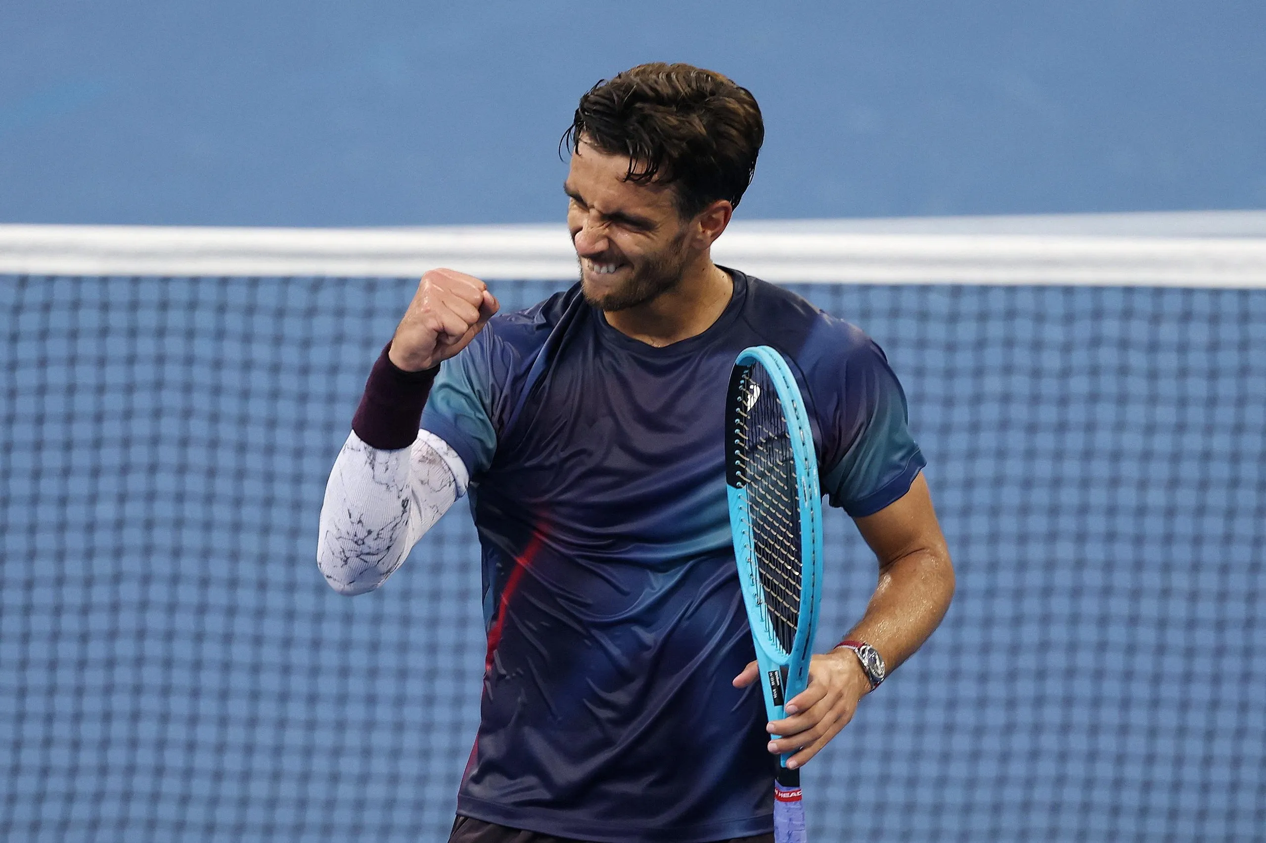 Lorenzo Musetti celebrates after winning his first round match against Arthur Fery.