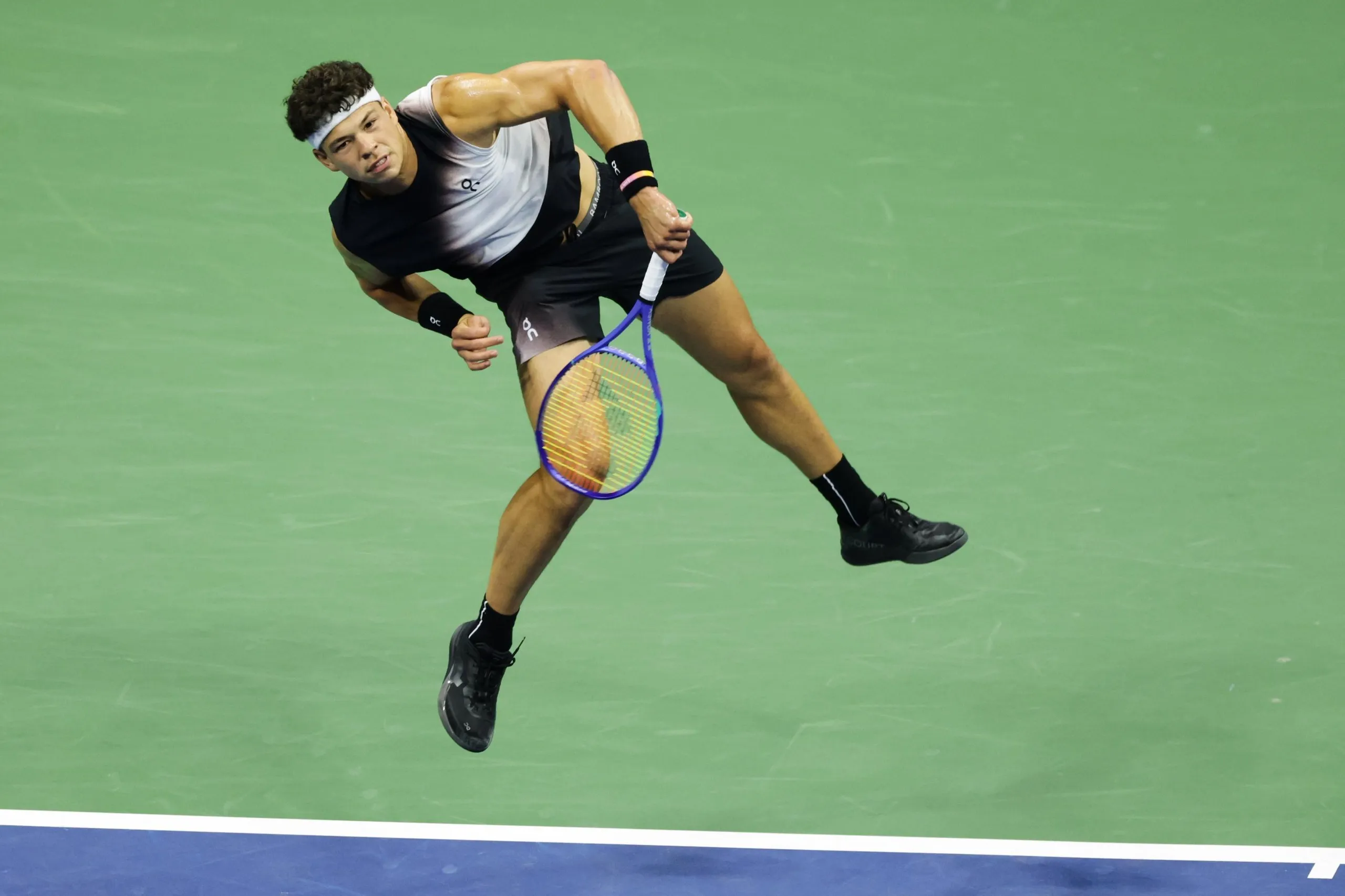 Ben Shelton serves to Carlos Alcaraz during their US Open quarter-final at Flushing Meadows.