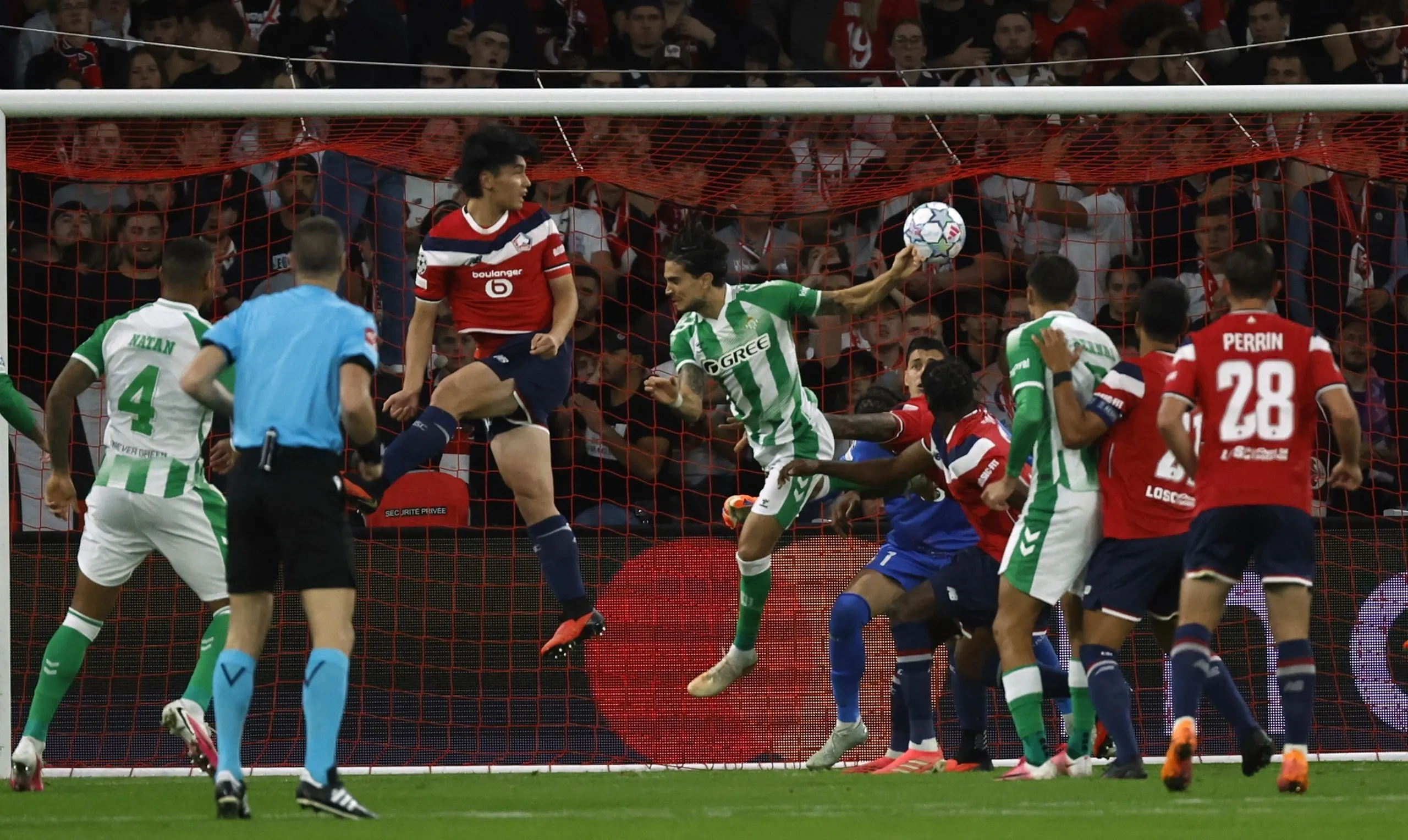Real Betis's Marc Bartra (centre) equalises with his second goal of the game.