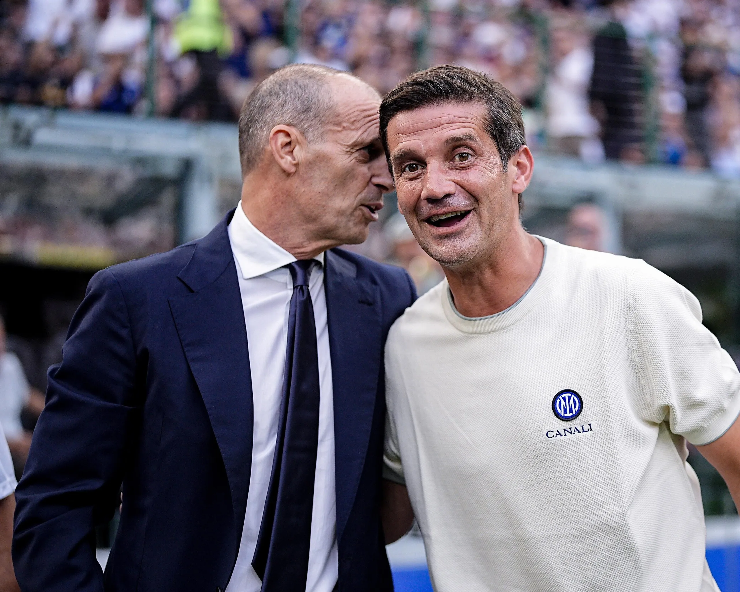 Massimiliano Allegri and Cristian Chivu greet each other before the Serie A match between Inter and Napoli