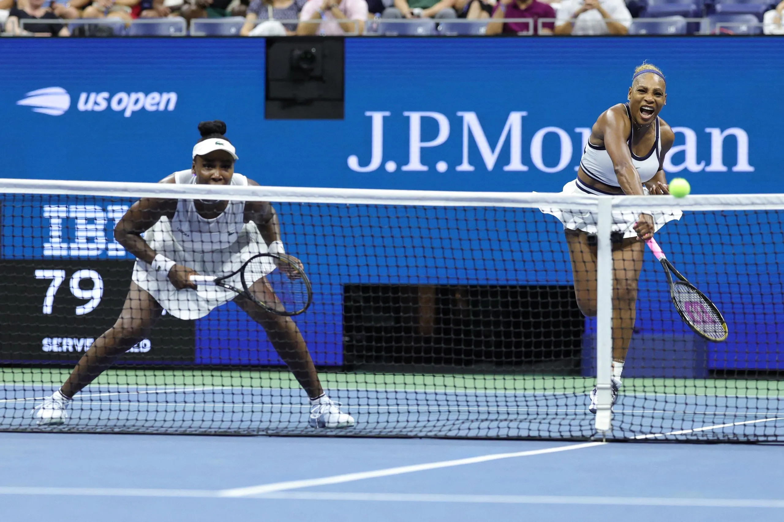 Serena Williams serves alongside sister Venus during a women’s doubles first round match at the 2026 US Open