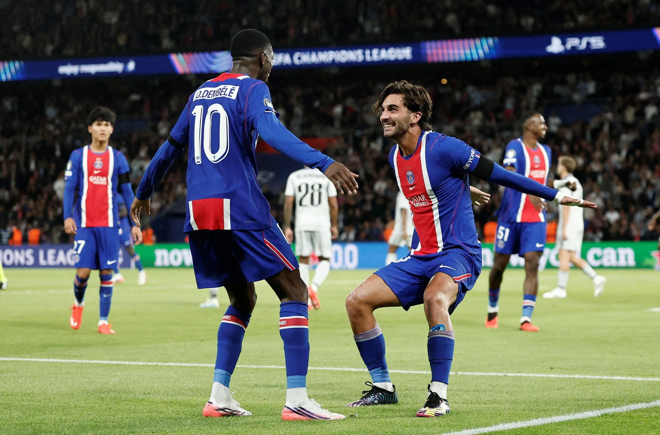 Paris Saint-Germain’s Ferran Torres celebrates scoring their fifth goal with Ousmane Dembélé