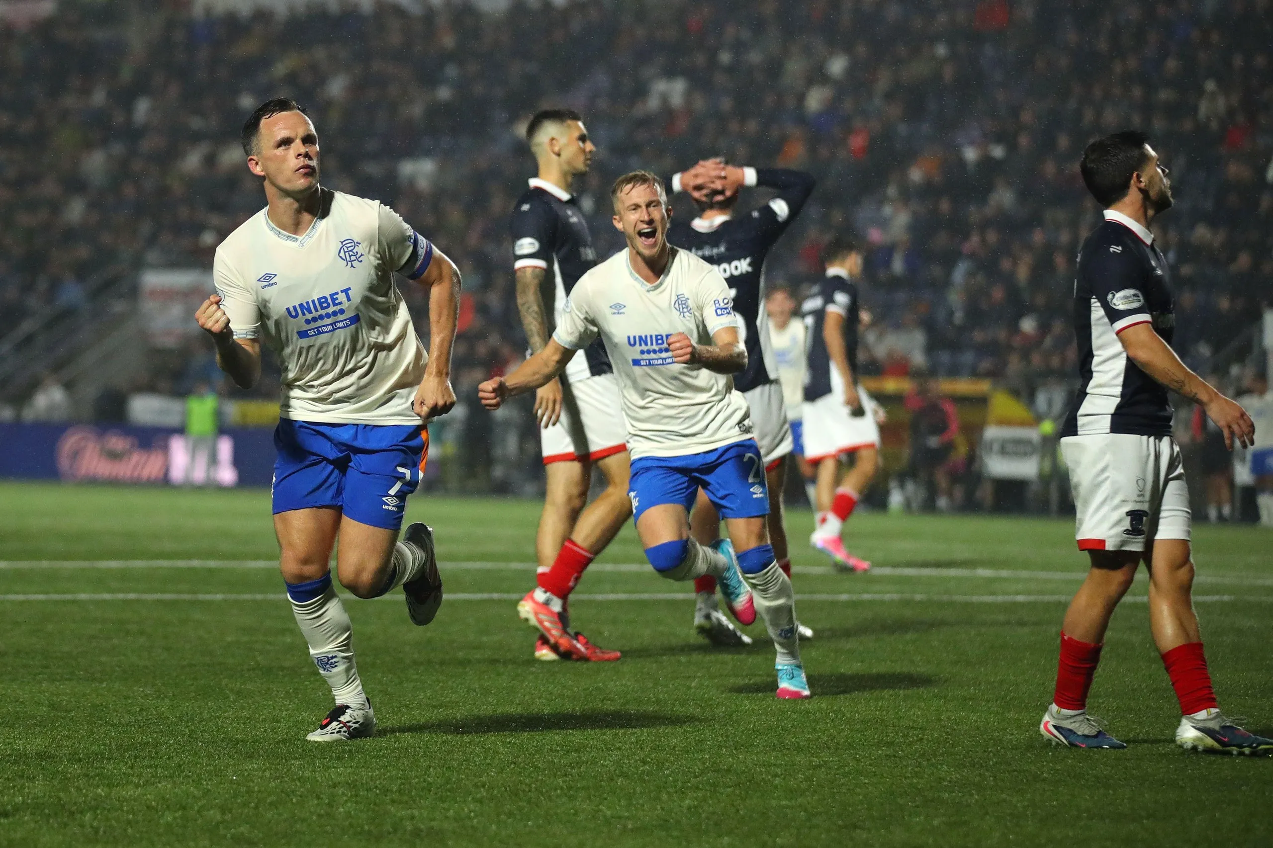 Lawrence Shankland runs with a clenched fist in celebration