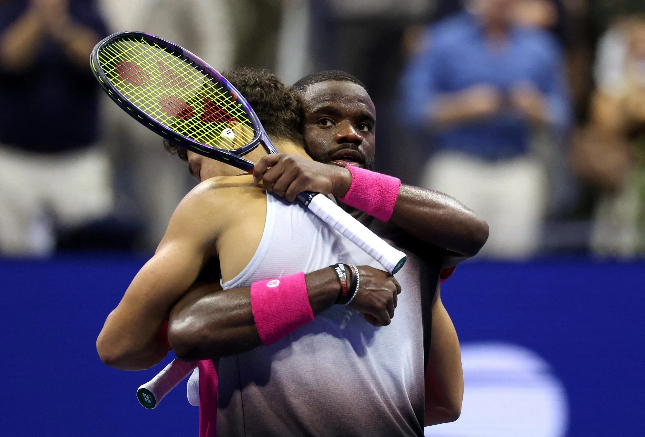 Ben Shelton embraces Frances Tiafoe after winning their US Open semi-final at Flushing Meadows.