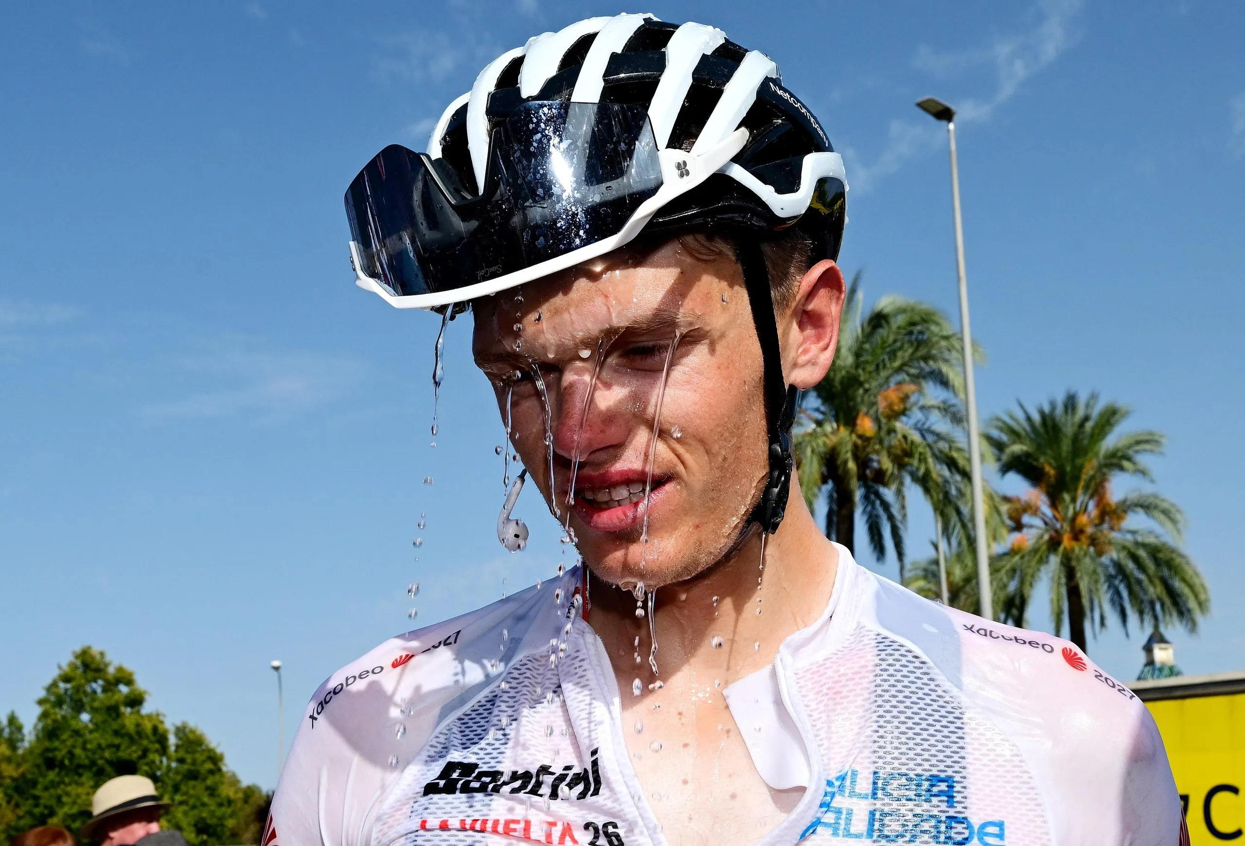 Oscar Onley, of the Netcompany Ineos Cycling team, cools down after racing in stage 15’s extreme heat.