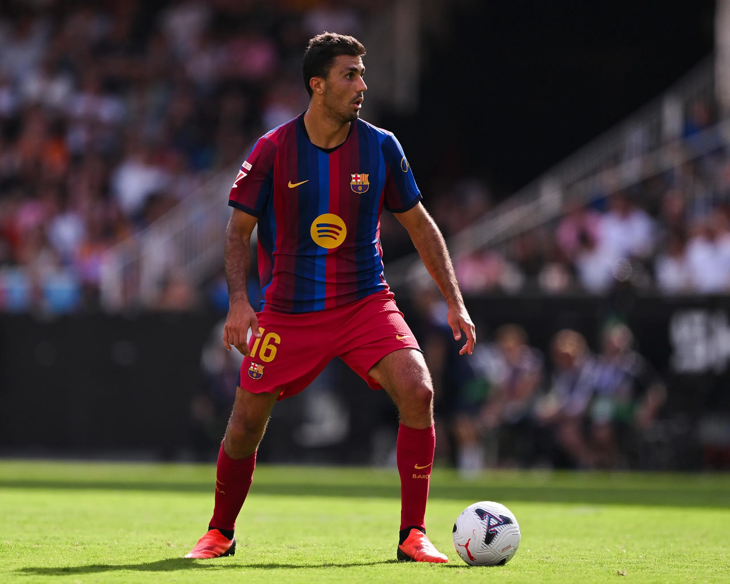 Rodri runs with the ball during La Liga match between Valencia and Barcelona
