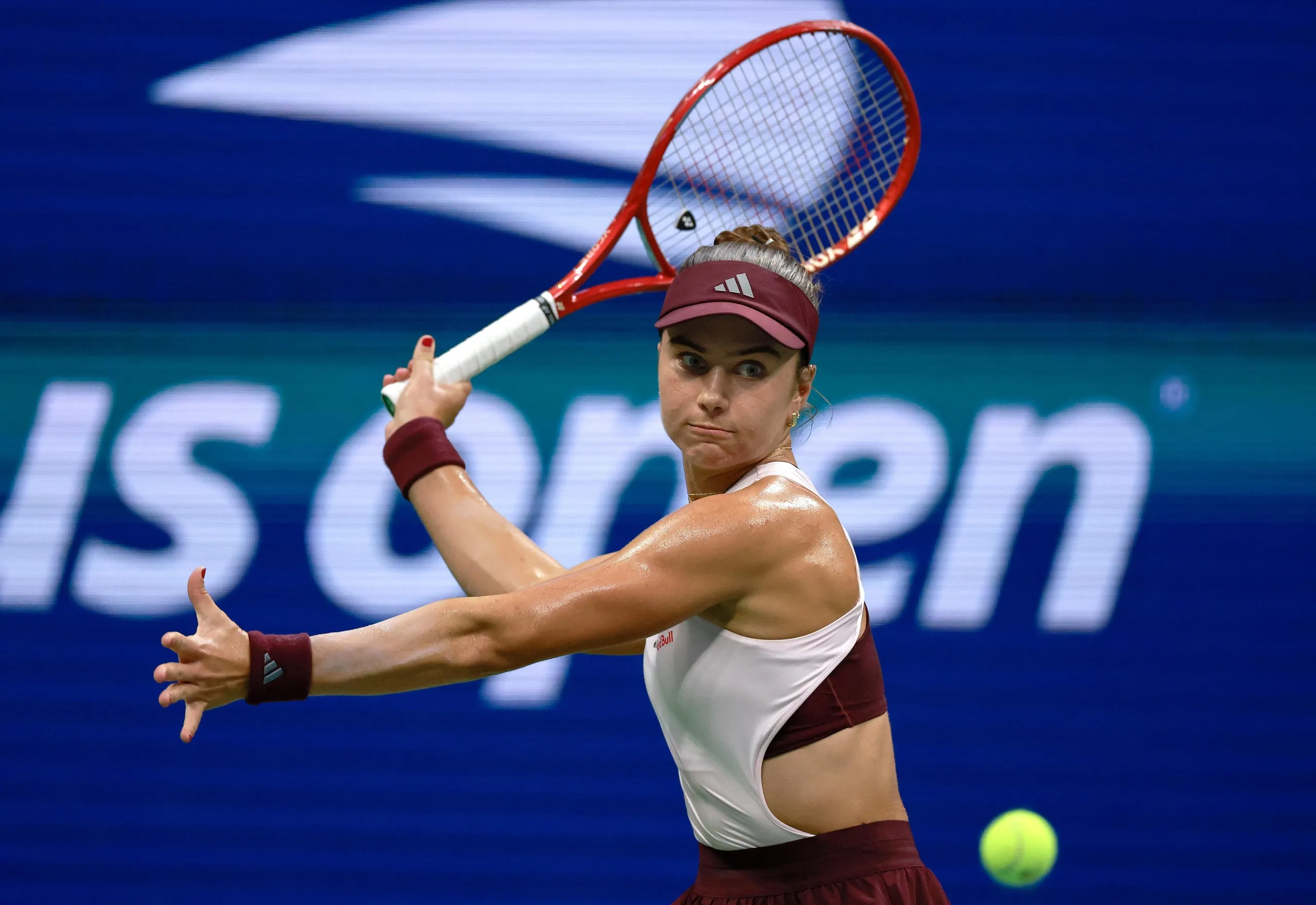 Iva Jovic returns a shot against Coco Gauff during their fourth-round match at the US Open.