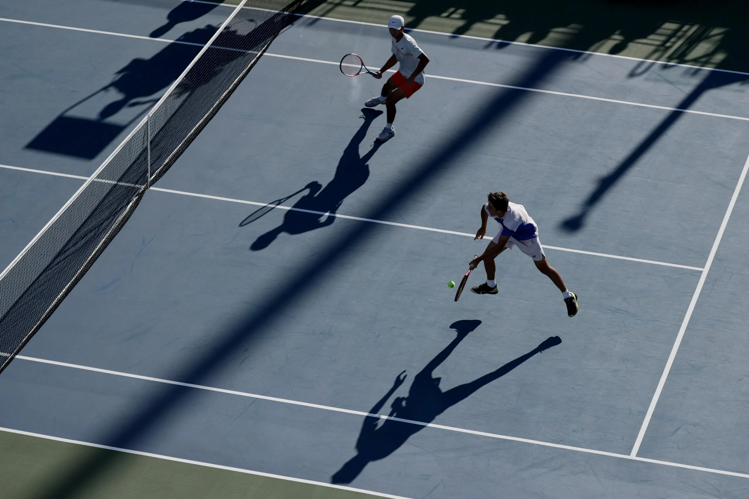Teodor Davidov, left, and Tyler Lee in action during the junior boys’ doubles competition at the US Open.