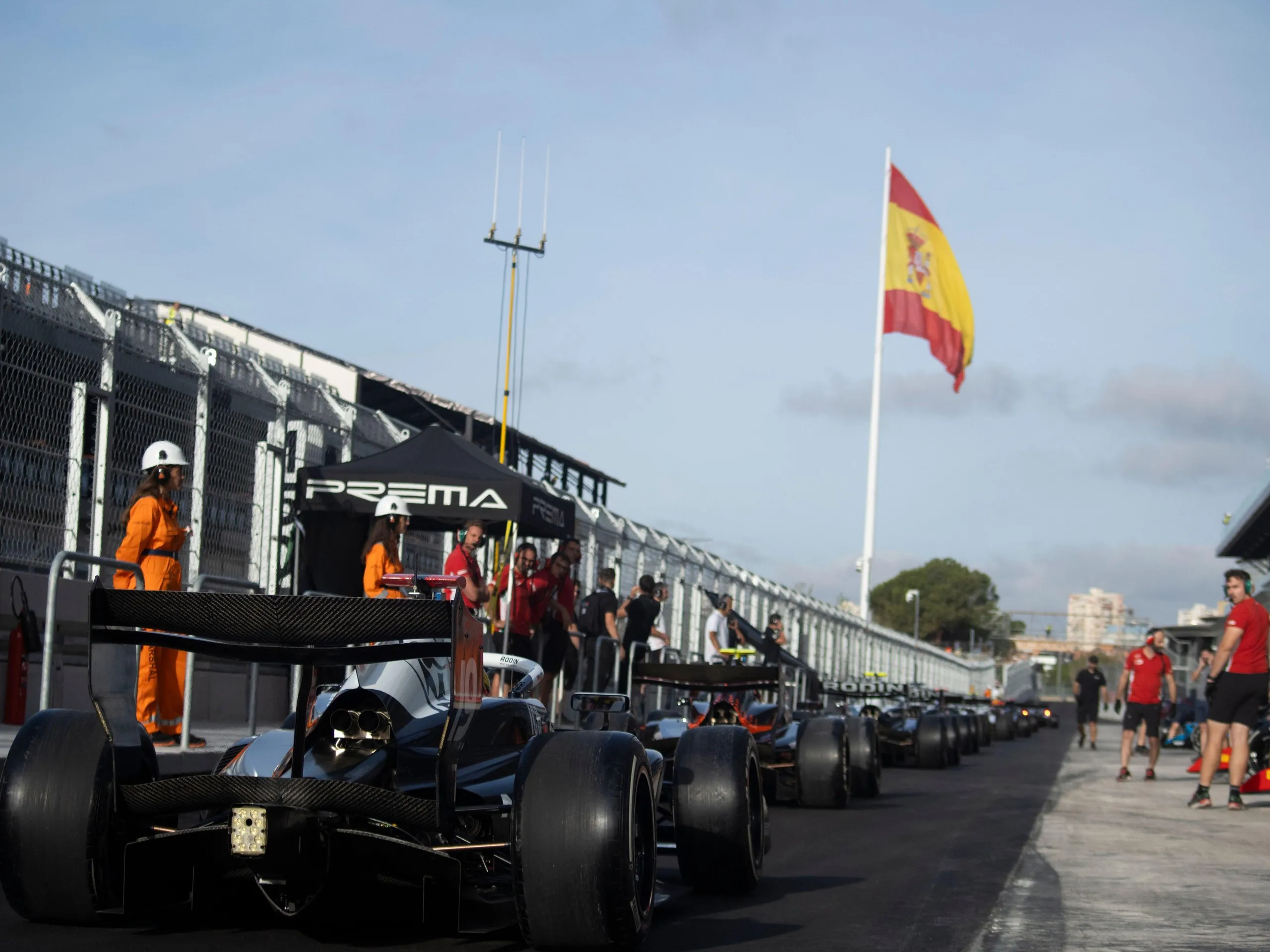 Formula 3 cars line up at the pit exit