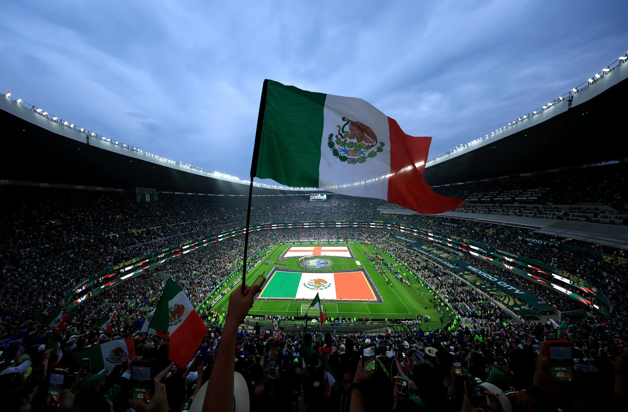 Mexico fans wave the national flag high up in the Azteca Stadium