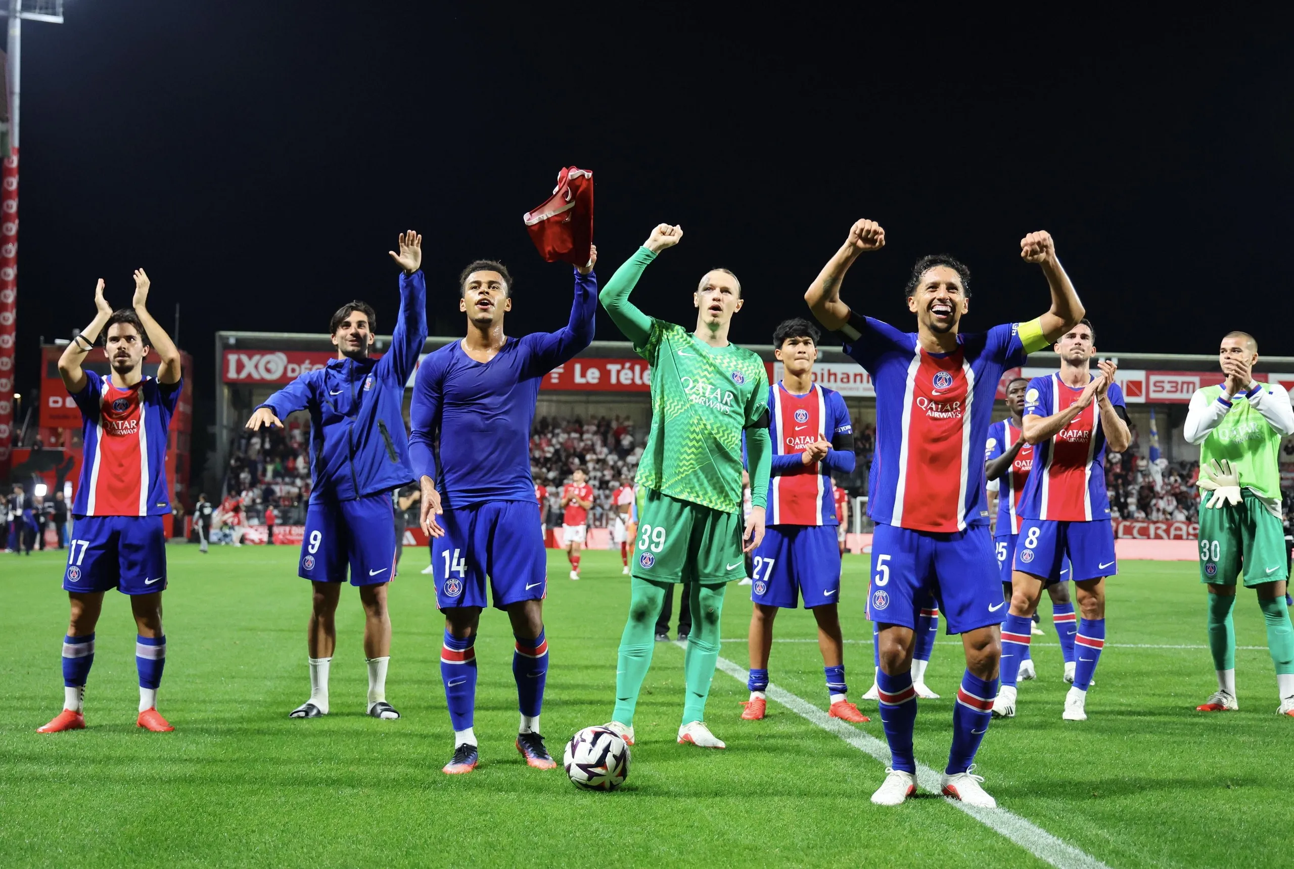 Matvey Safonov celebrates with his teammates after the Ligue 1 match between PSG and Brest