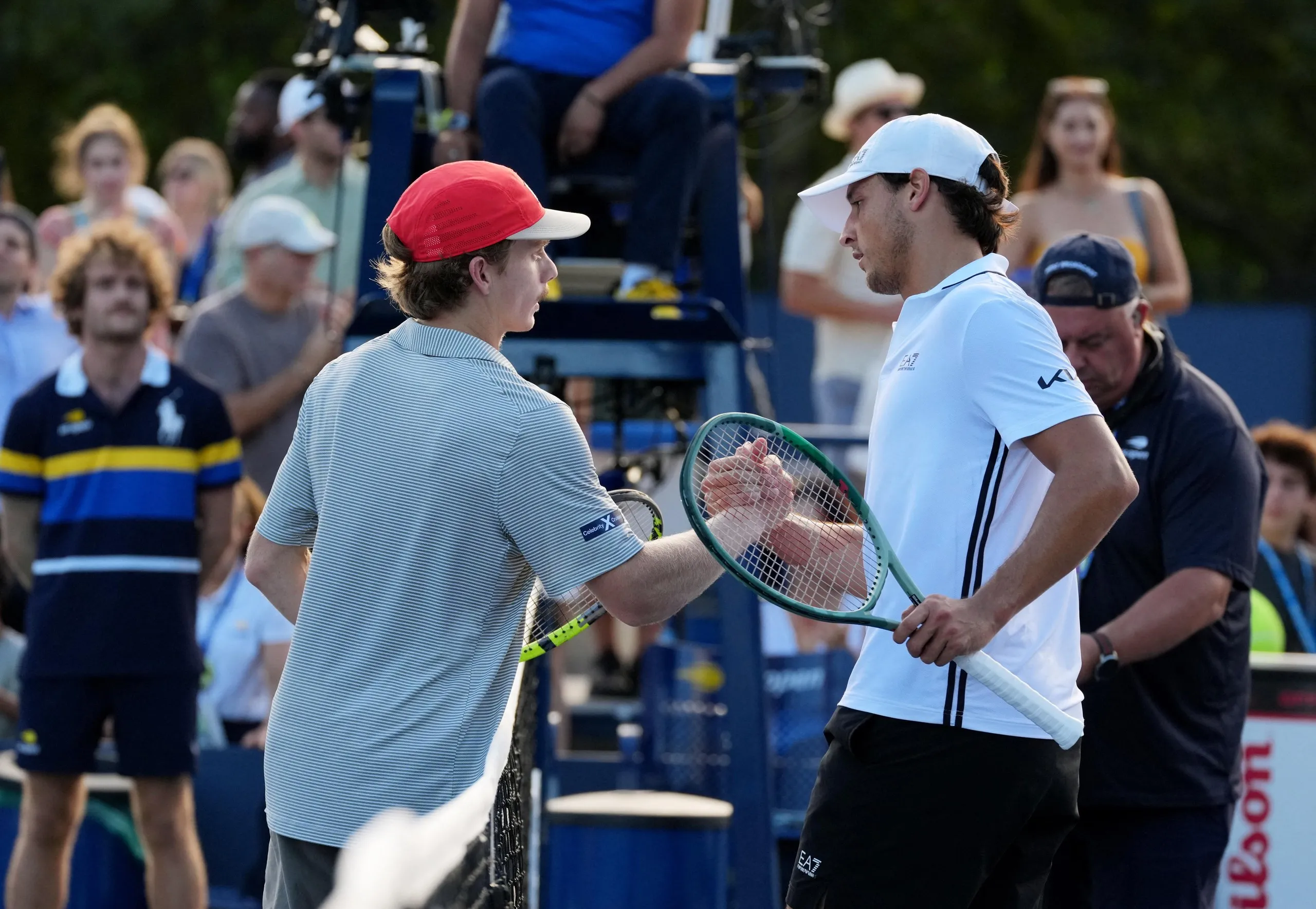 Dane Sweeney and Luciano Darderi shake hands at the net after their third-round match