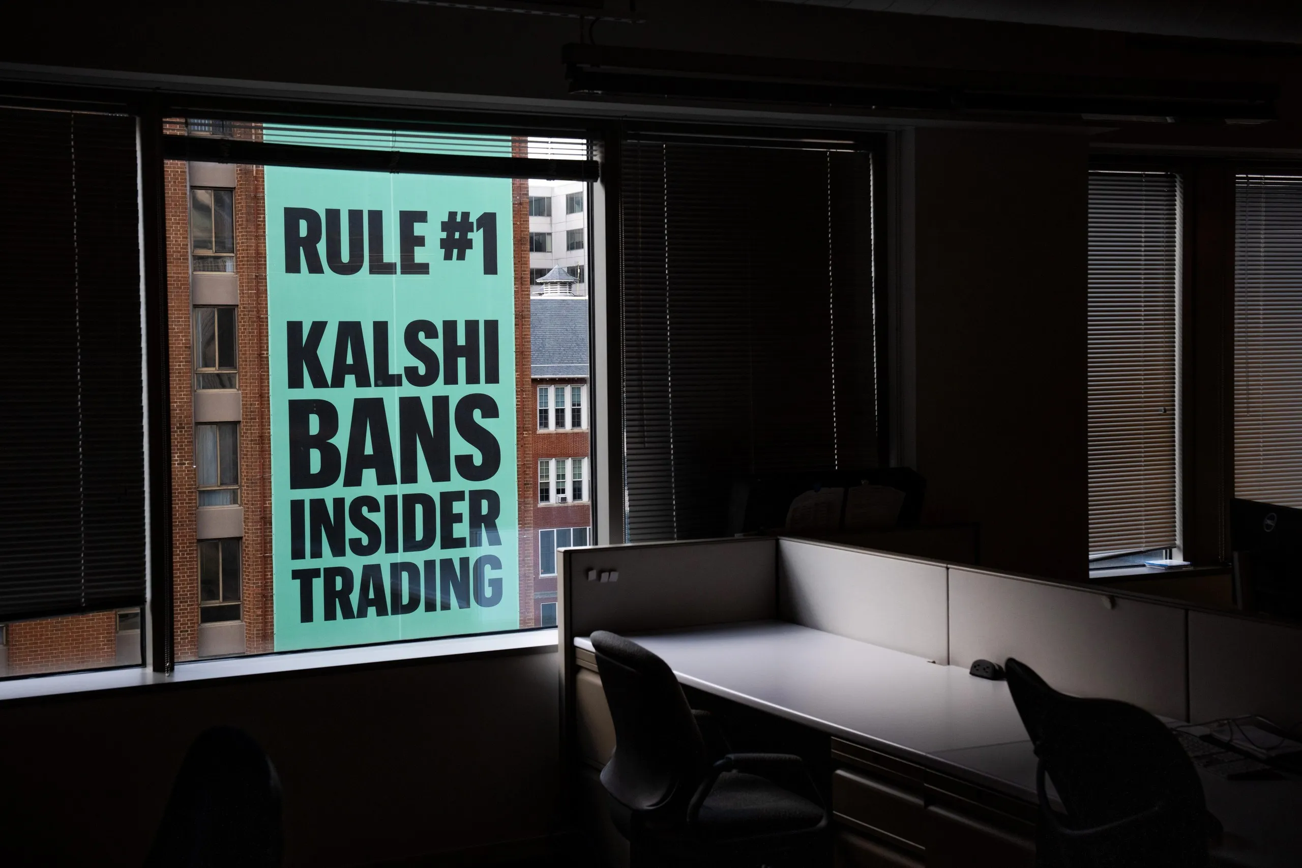 a Kalshi ad on a window