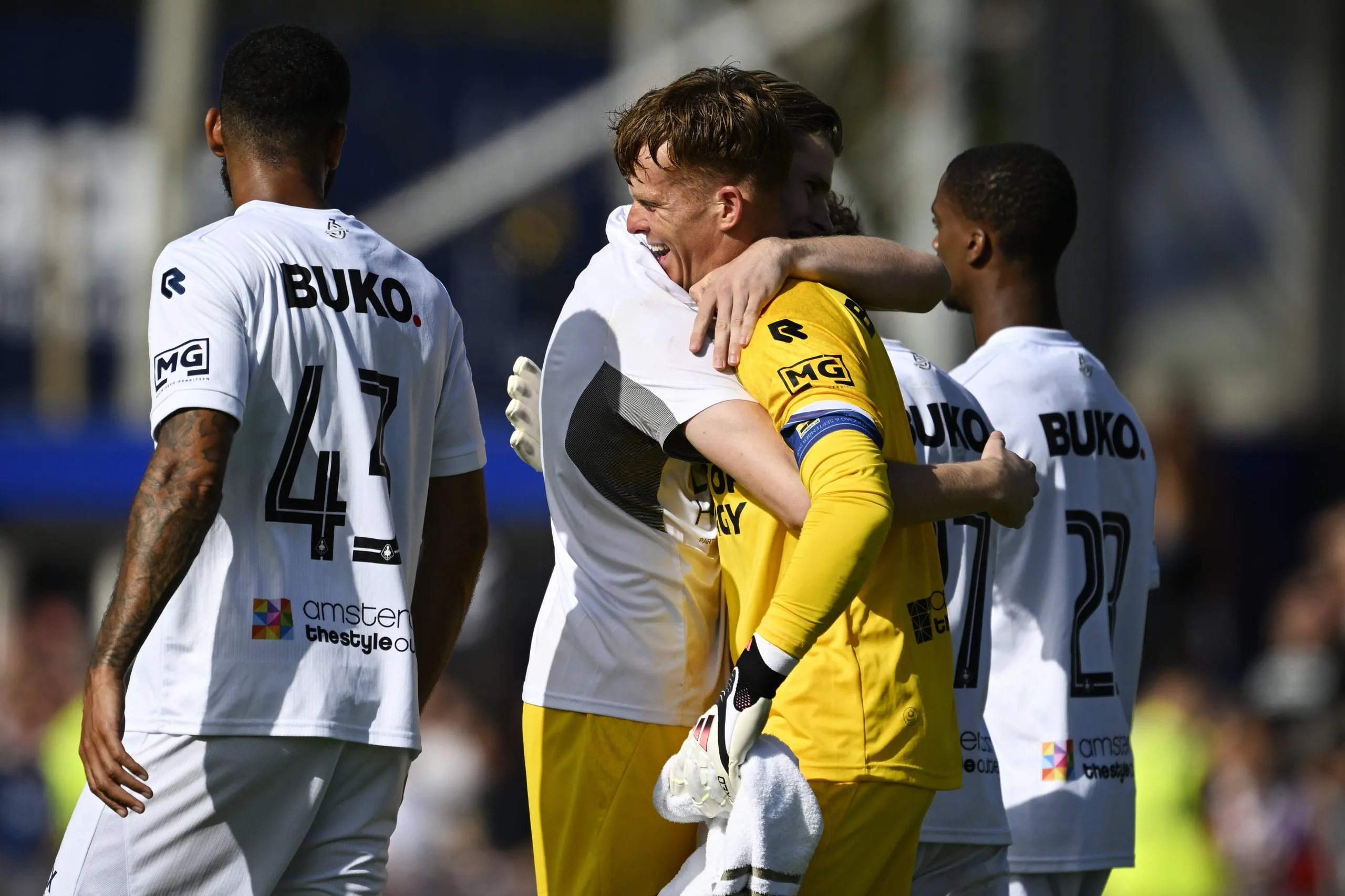 Telstar goalkeeper Ronald Koeman Jr is hugged by a team-mate after his late penalty rescued a point.
